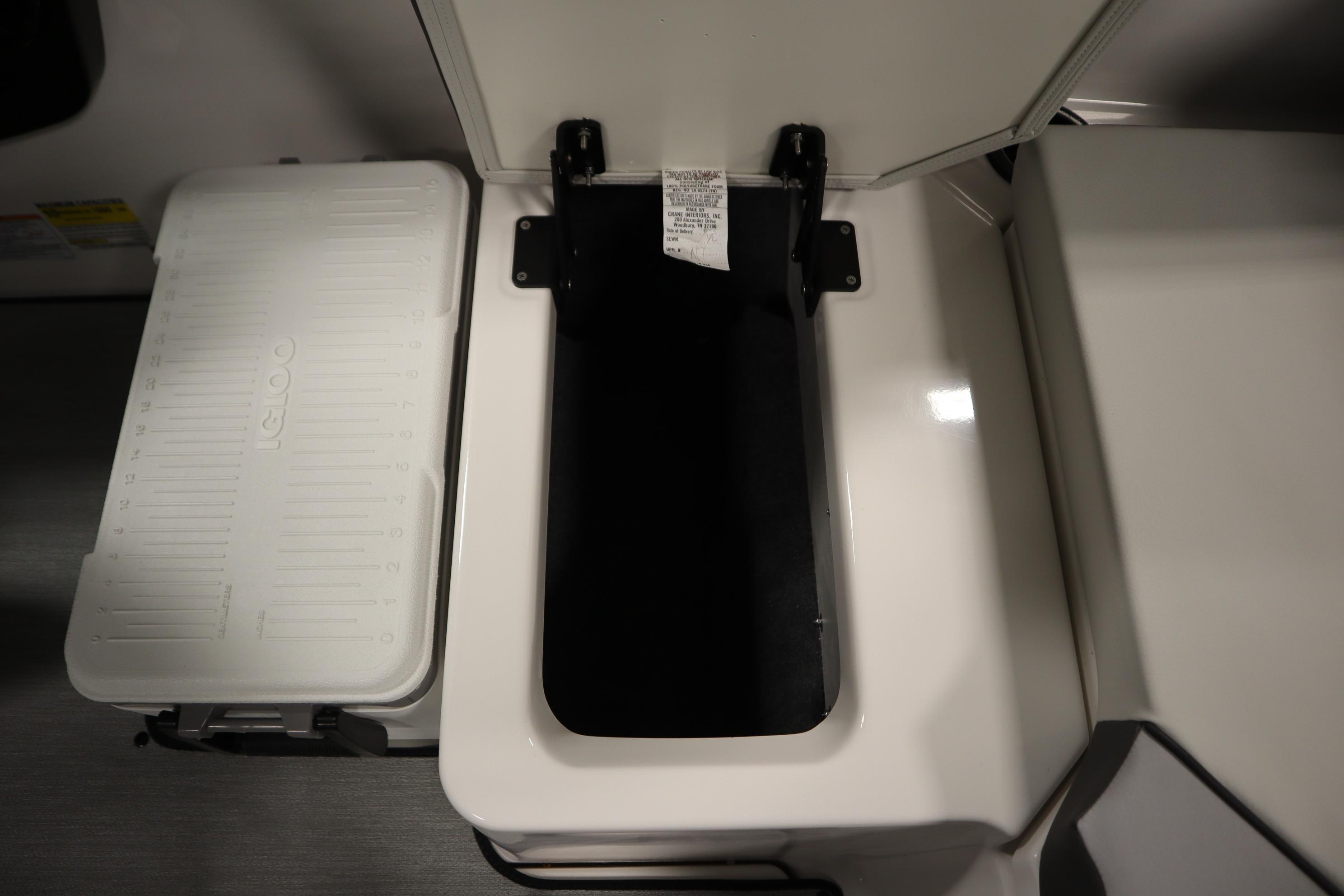 2026 Yamaha Boats AR220 storage compartment with Igloo cooler, open lid view.