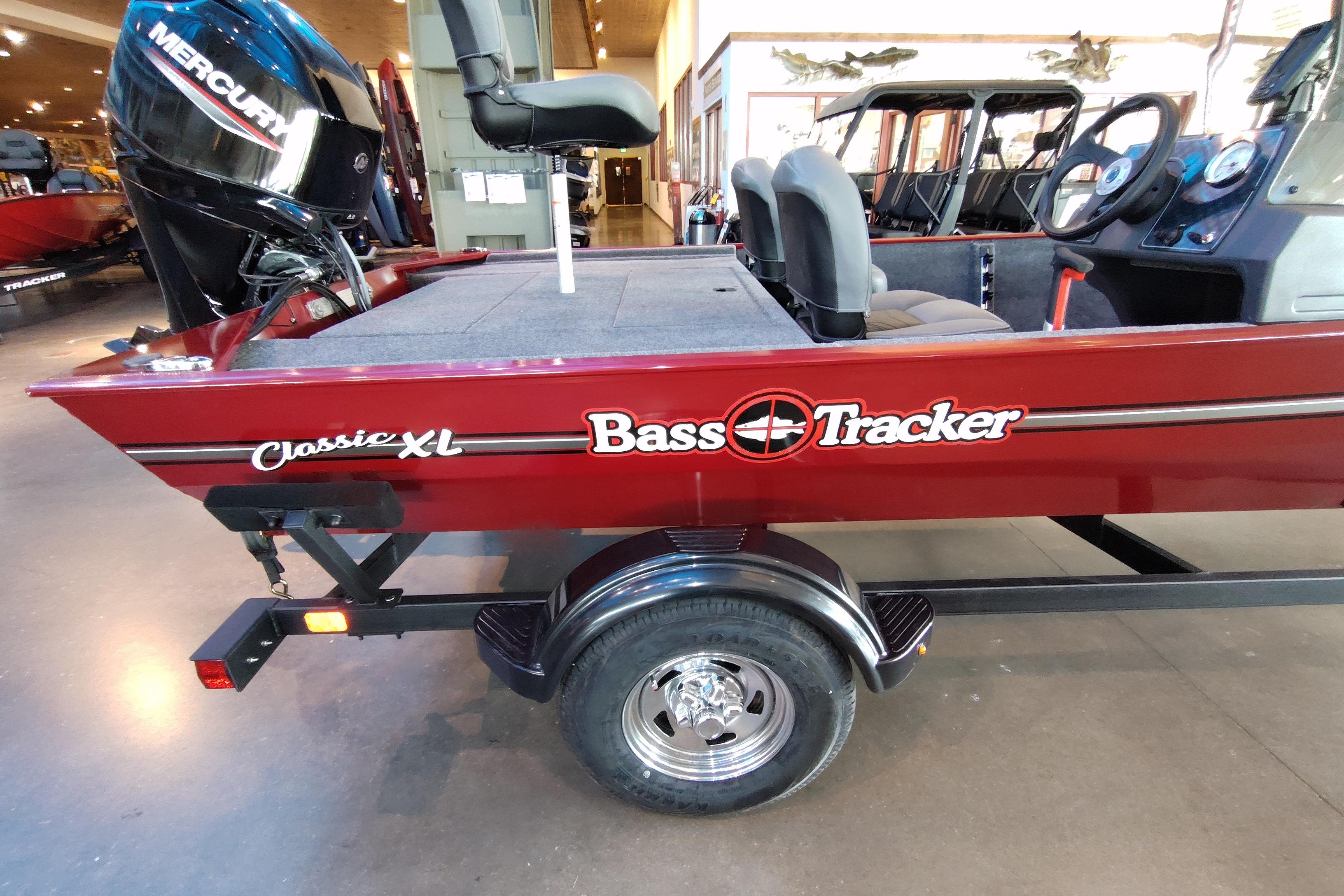 2026 Tracker Bass Tracker Classic XL boat with Mercury engine in showroom.