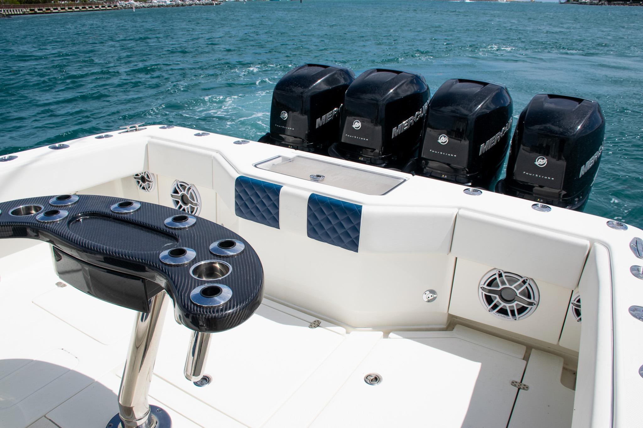 2022 SeaVee 390Z boat with multiple Mercury outboard engines on blue water.