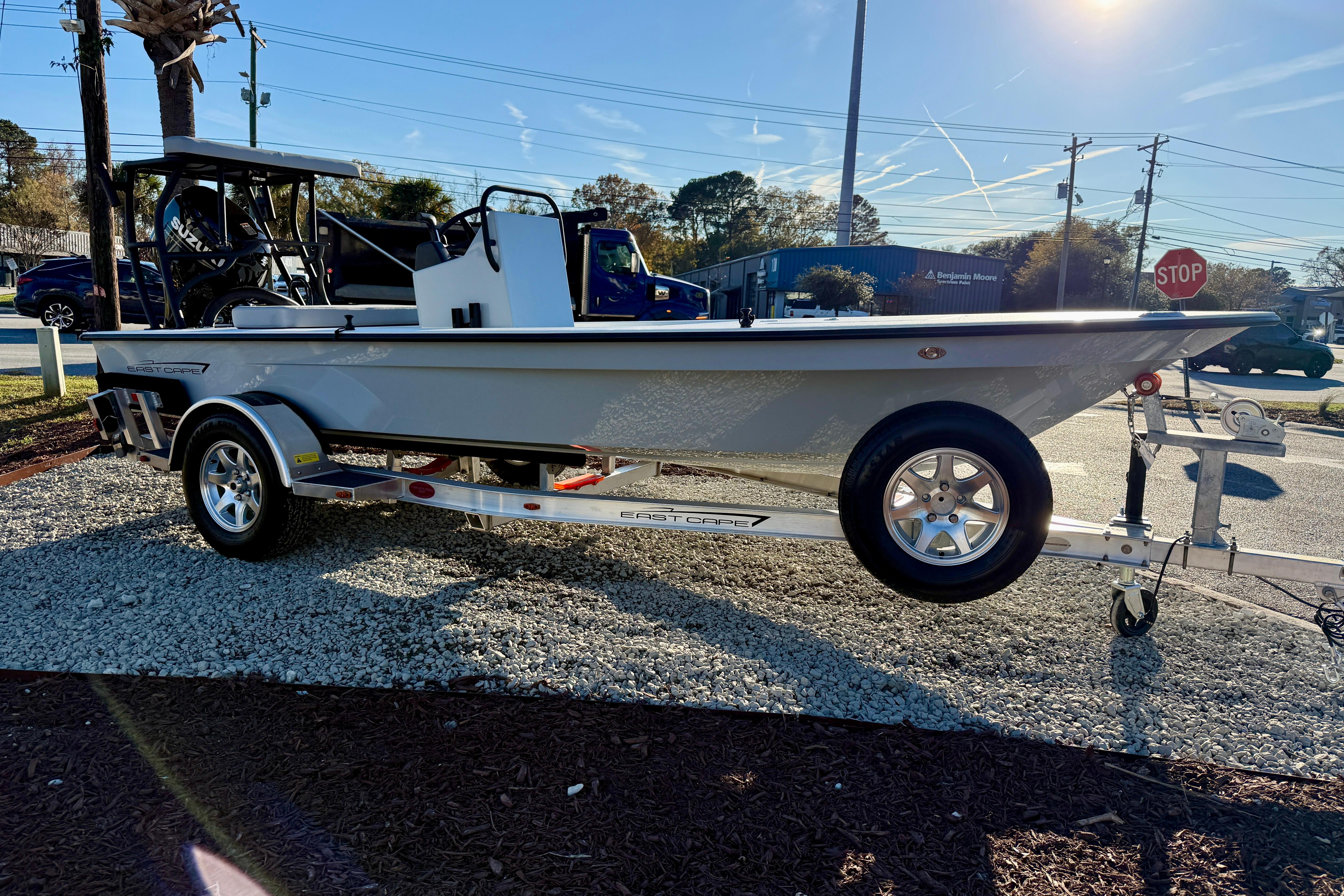 2026 East Cape EVO 17V boat on trailer, parked outdoors in sunlight.