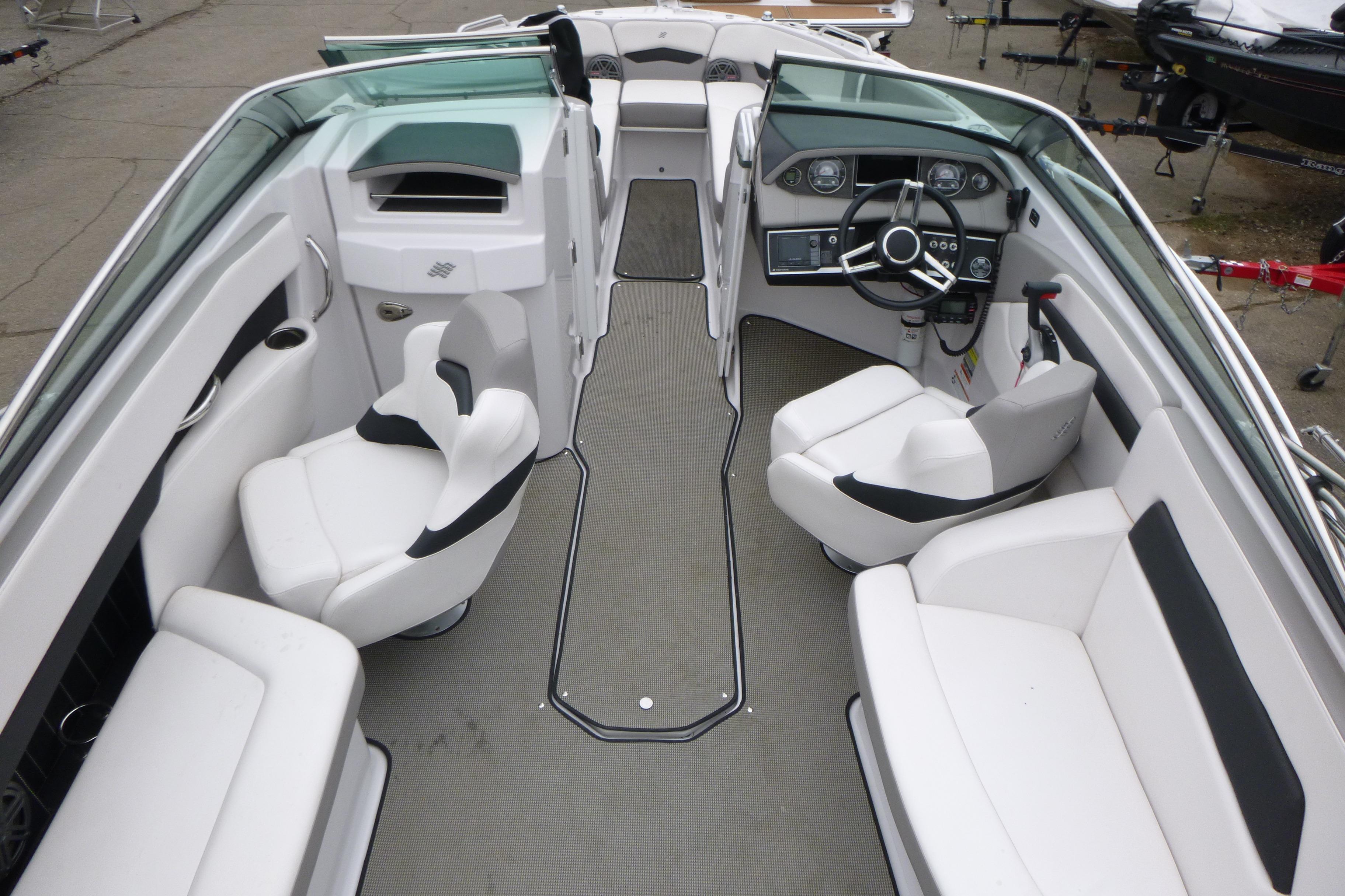 2017 Four Winns H260 boat interior with white seating and modern dashboard.