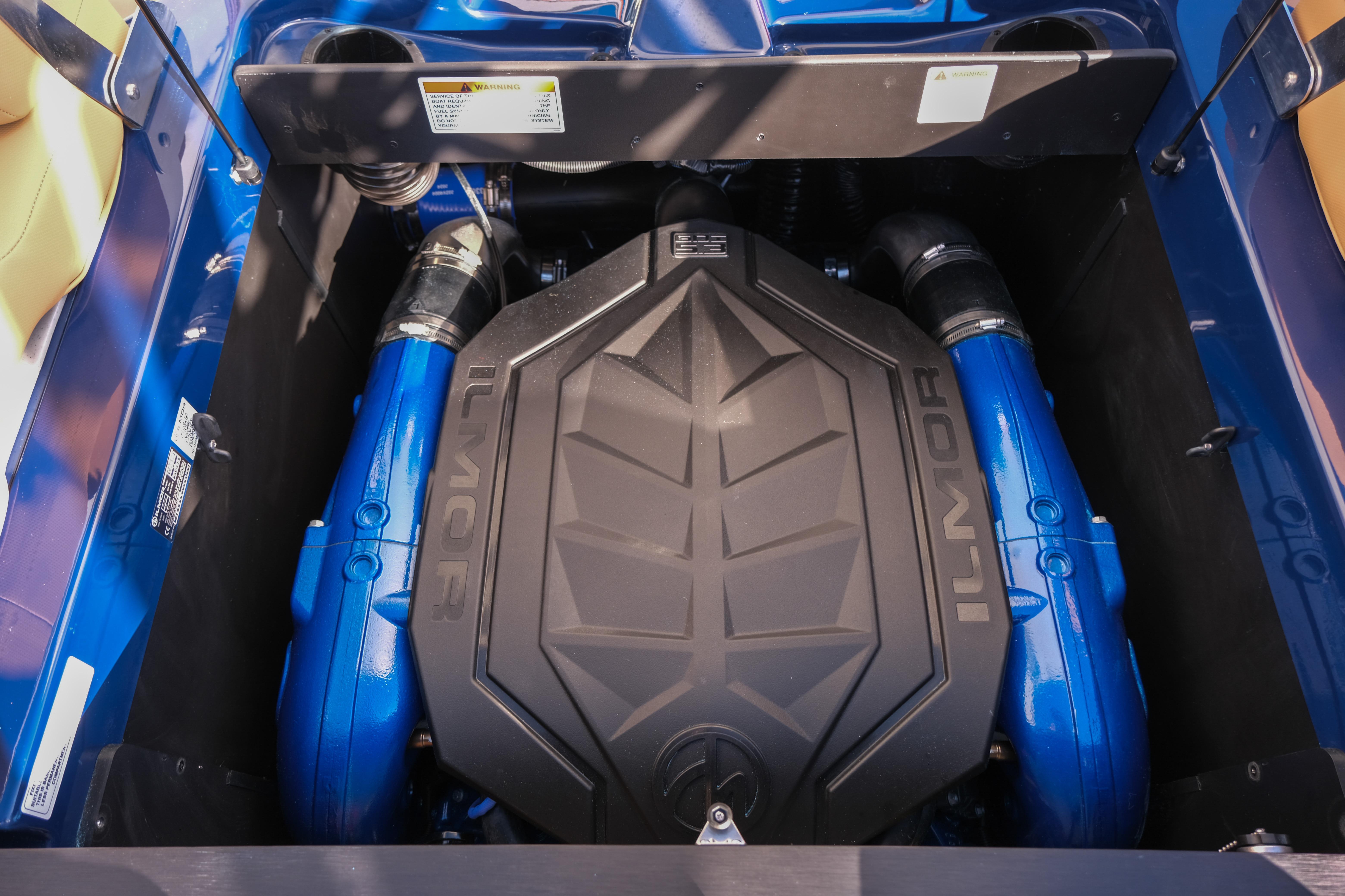 2026 MasterCraft XT22 engine compartment with Ilmor engine, showcasing blue components.