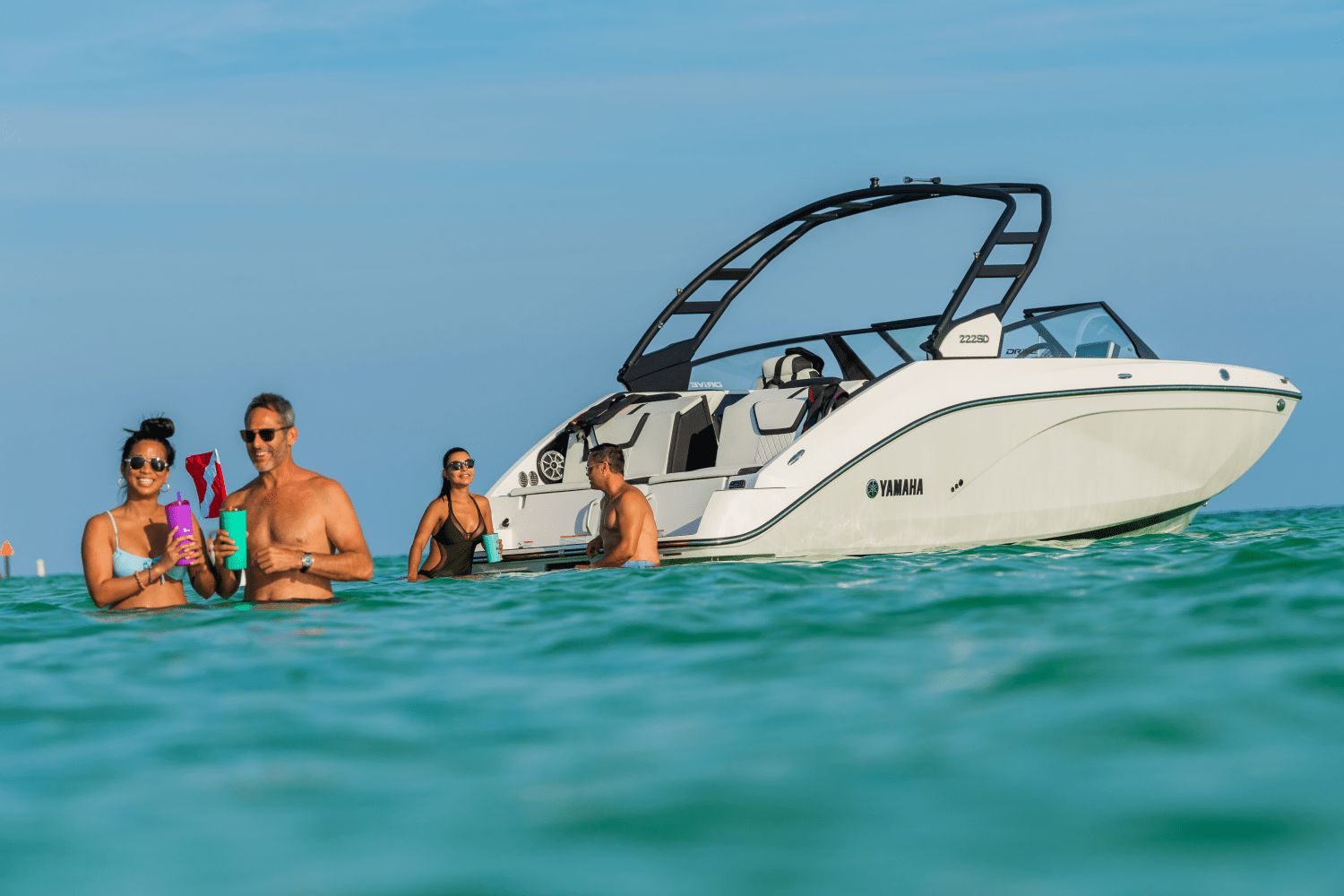 Yamaha 222SD from 2026 on the water with people swimming in the sea.