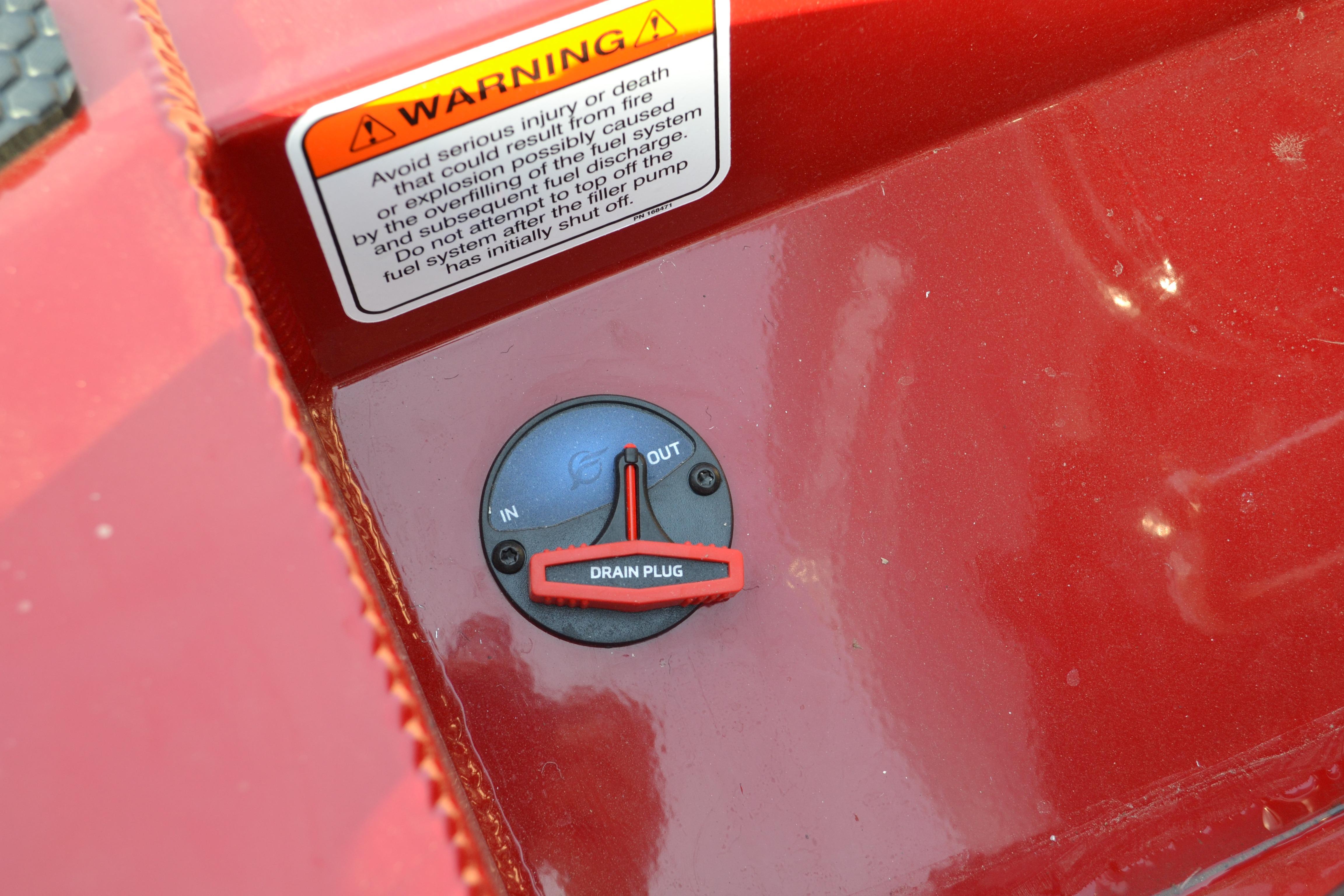 2026 Ranger RT188 boat drain plug with warning label on red surface.