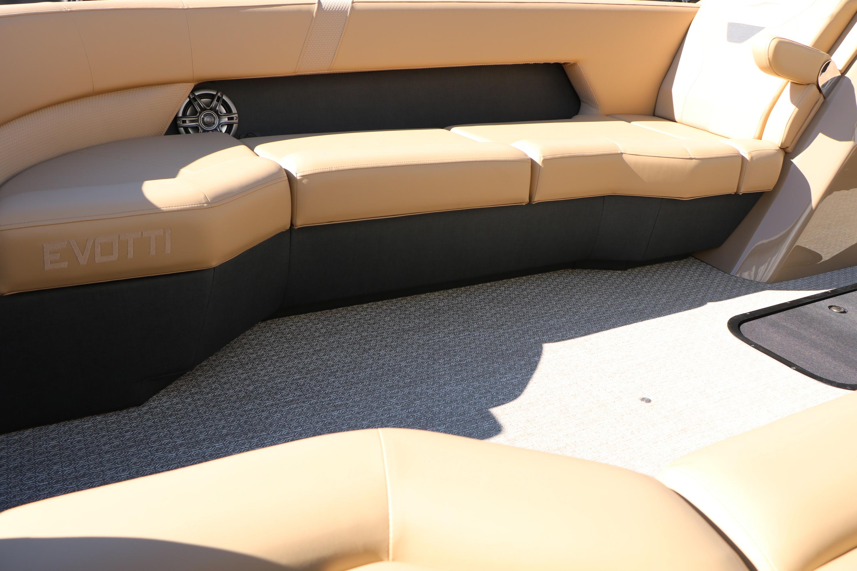 Luxurious seating on 2026 Evotti 525 QL Tri-Toon boat, featuring tan upholstery and sleek design.