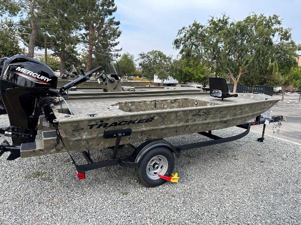 2024 Tracker Grizzly 1654 T Sportsman boat with Mercury engine on trailer.