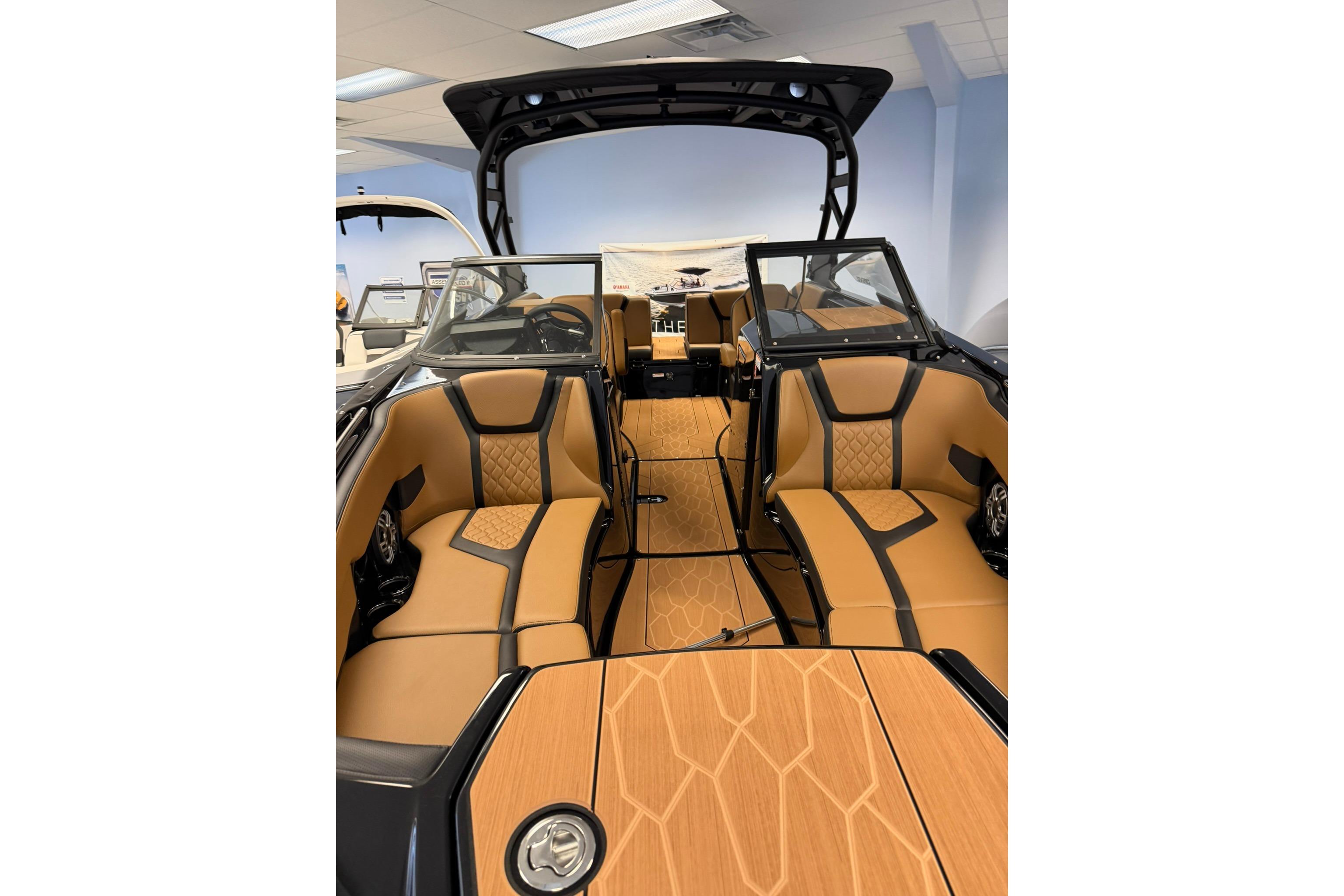 2026 Yamaha Boats 255XD interior with tan and black seating, modern design.