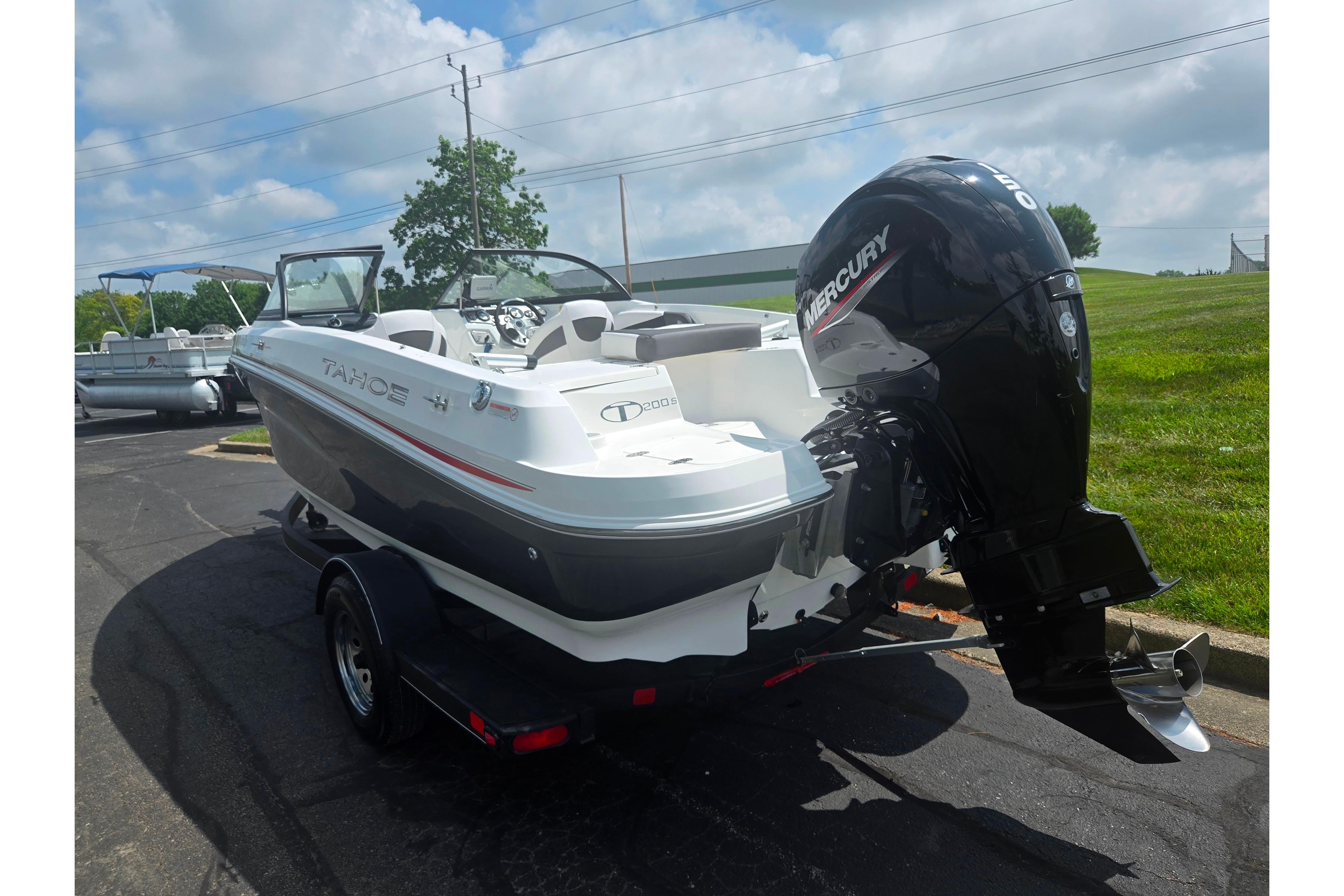 2023 Tahoe 200 S boat with Mercury outboard motor on a trailer.