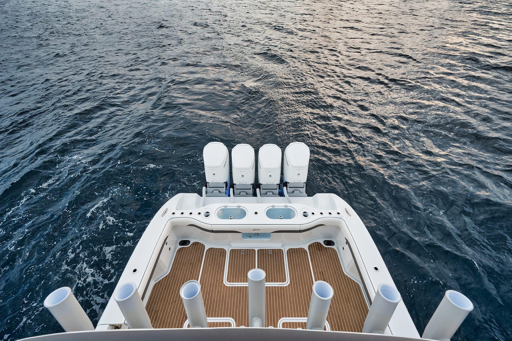 2022 Yellowfin 54 Offshore boat with quad engines on open water.