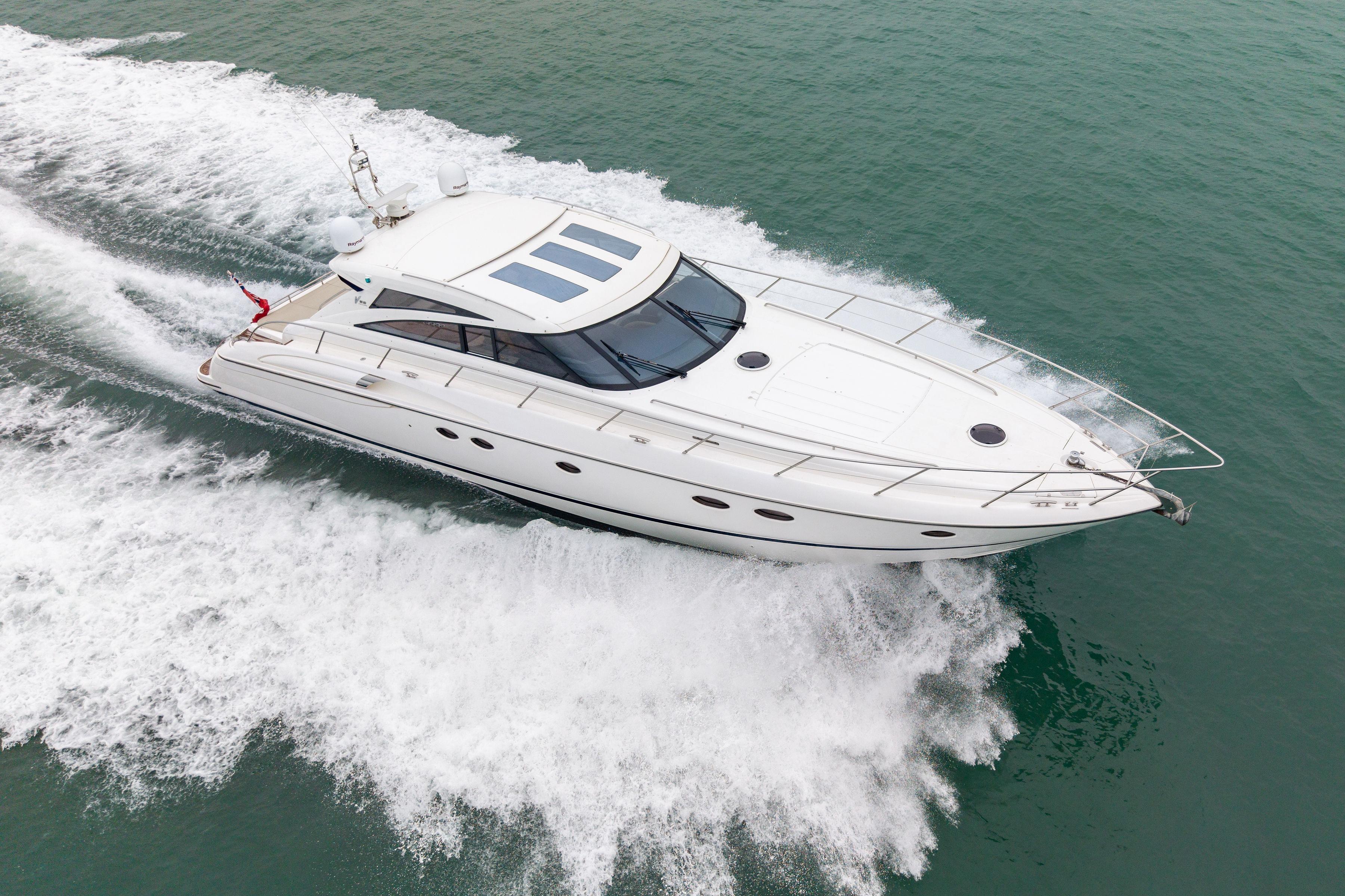 2009 Princess V58 yacht cruising swiftly on open water.