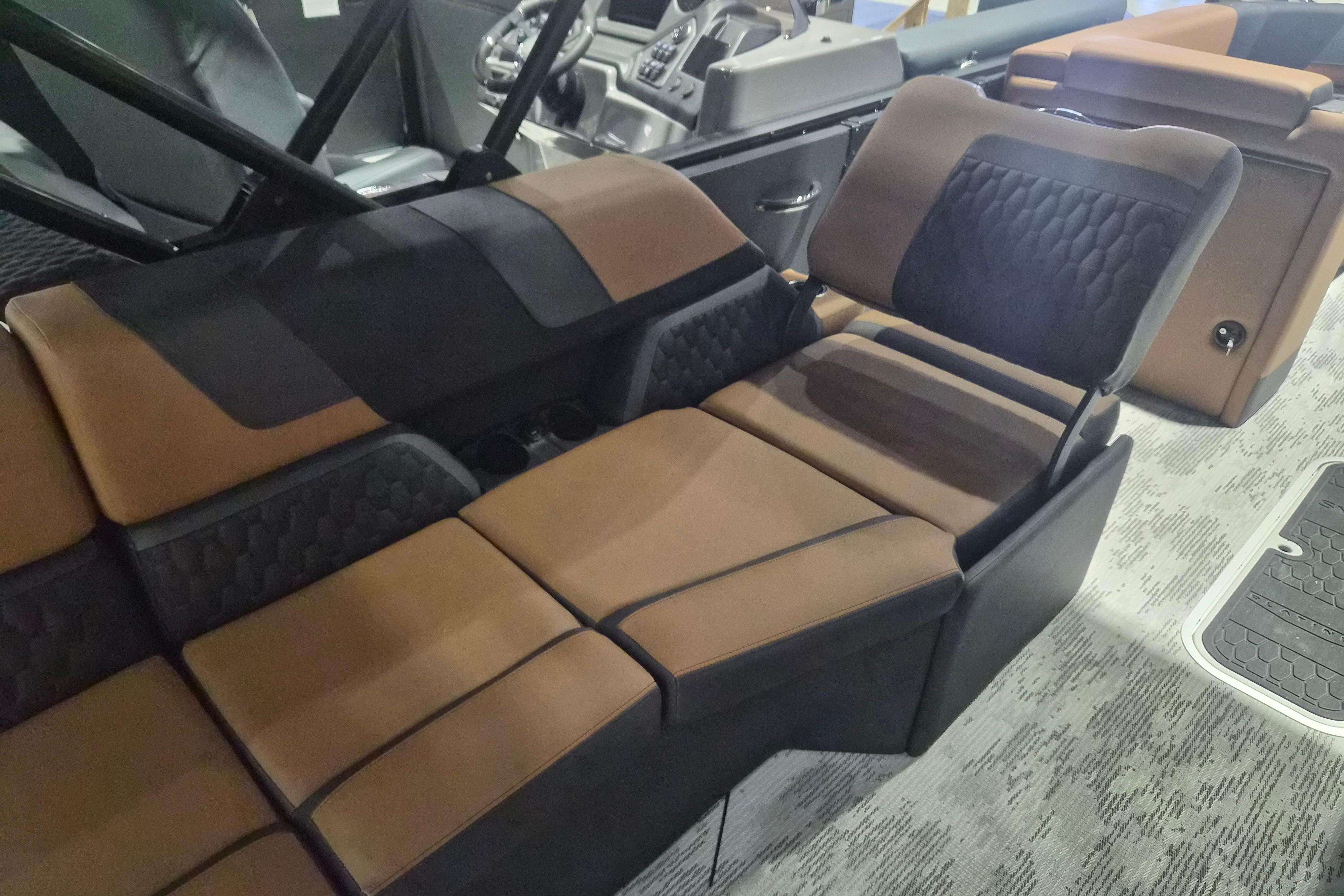 Luxurious interior seating of 2026 Sylvan L3 SLZ boat with brown and black upholstery.