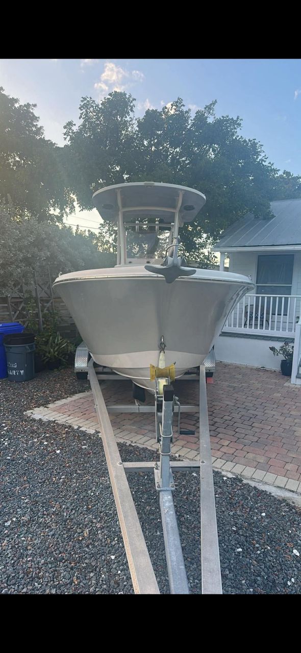 2019 Sea Chaser 24 HFC boat on trailer parked in front of house.