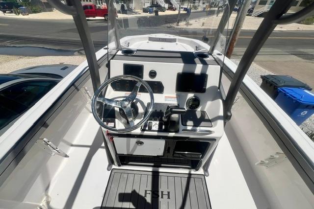 2019 Yamaha Boats 190 FSH Sport cockpit with steering wheel and controls.
