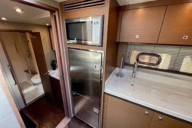 2016 Sea Ray Sundancer 510 yacht interior with modern kitchen and bathroom.