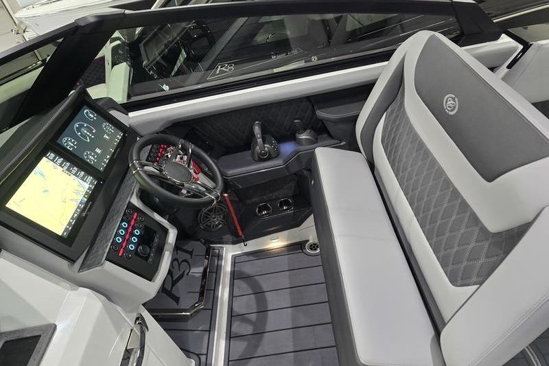 2026 Cobalt R31 boat interior with modern dashboard and luxurious seating.
