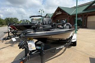 2026 Nitro Z19 XL boat displayed outside a store under a cloudy sky.