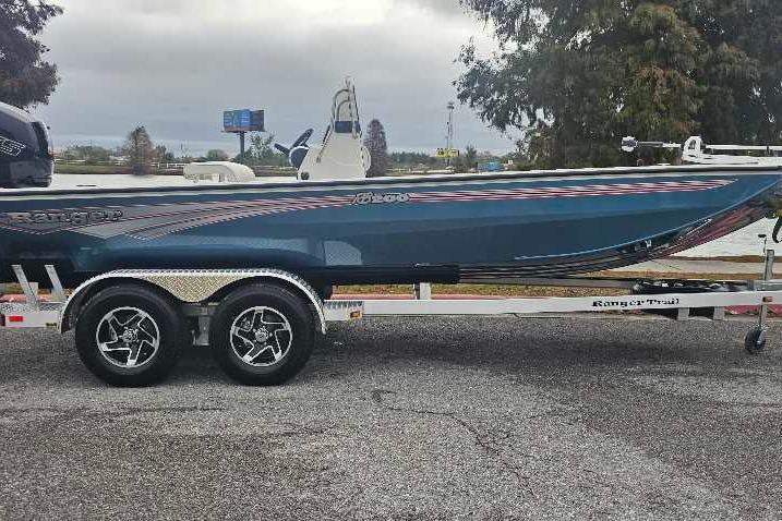 2026 Ranger RB200 boat on trailer, parked outdoors, showcasing sleek design and modern features.