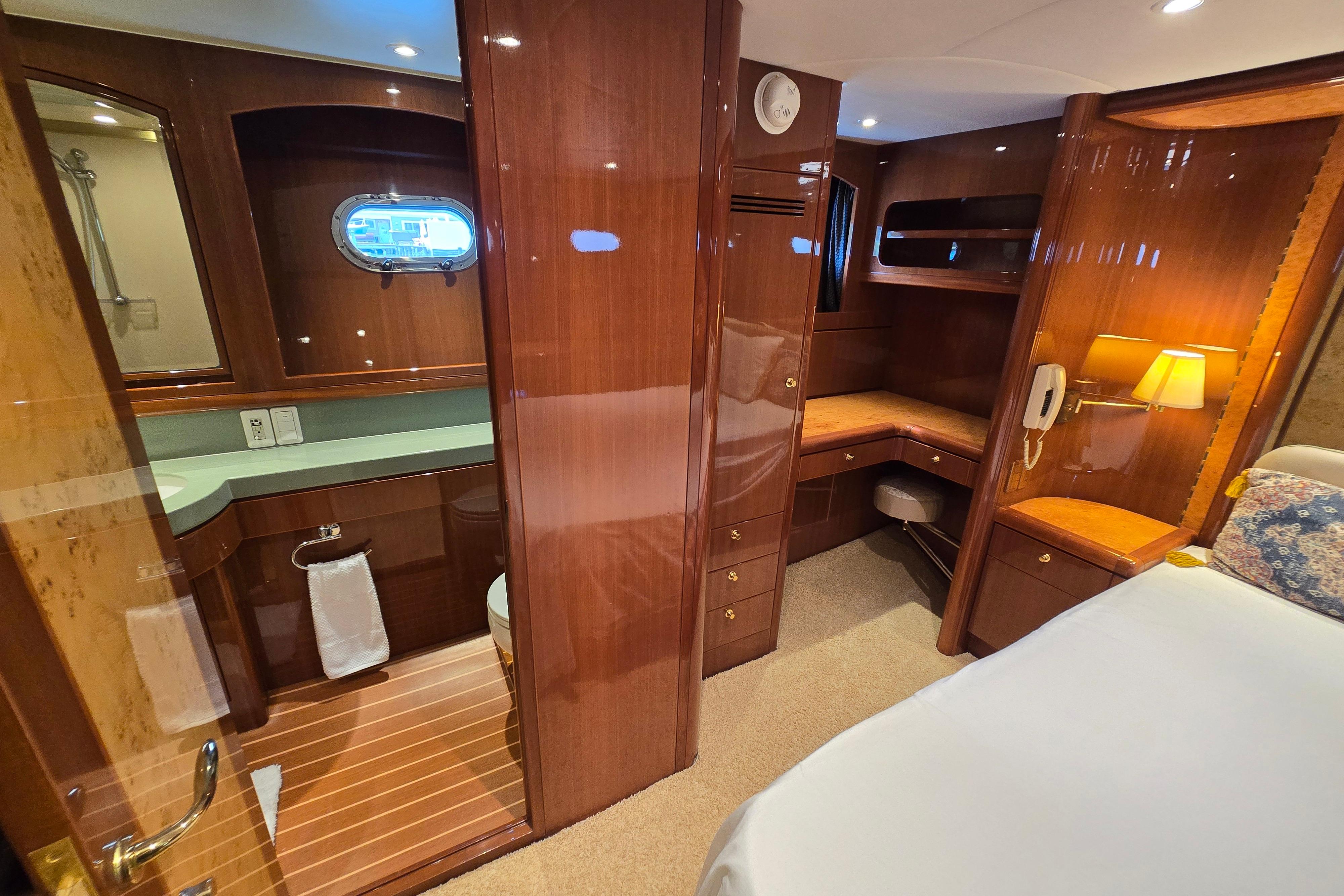 Luxurious 2004 Grand Harbour 58 yacht interior with wood finish and elegant furnishings.