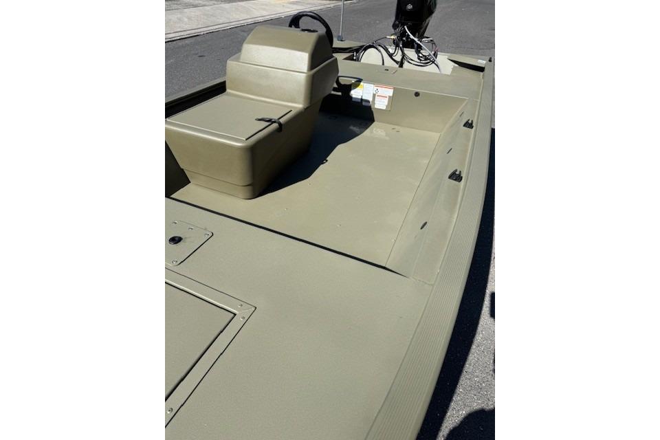 2026 Tracker Grizzly 1648 SC boat interior with steering console and seating.