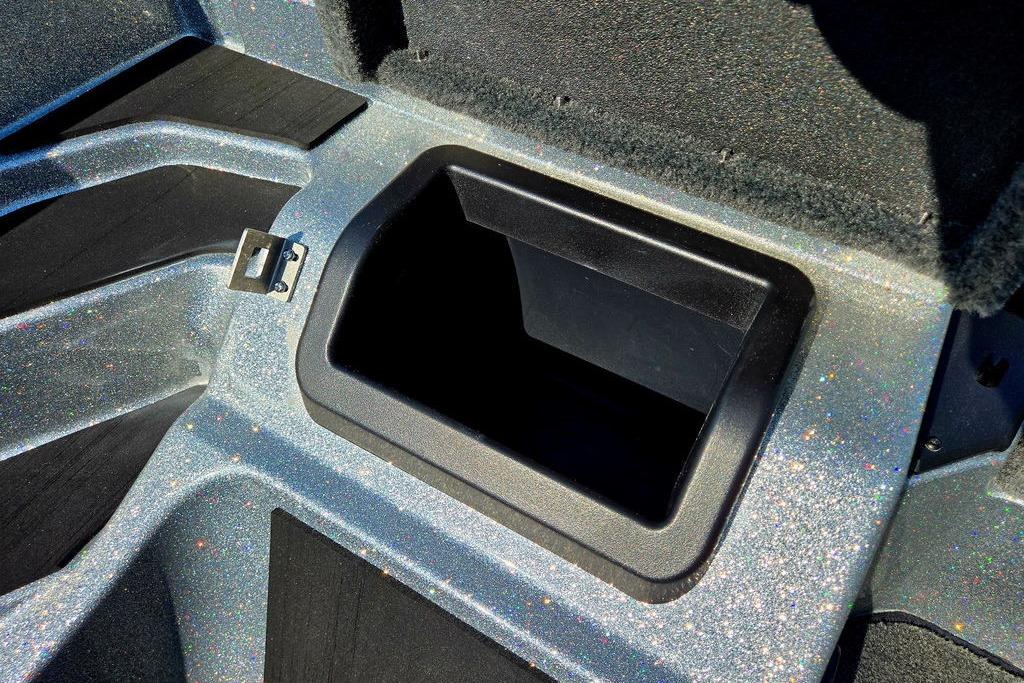 Storage compartment in 2026 Skeeter ZXE20 boat, featuring a sleek, glittery finish.