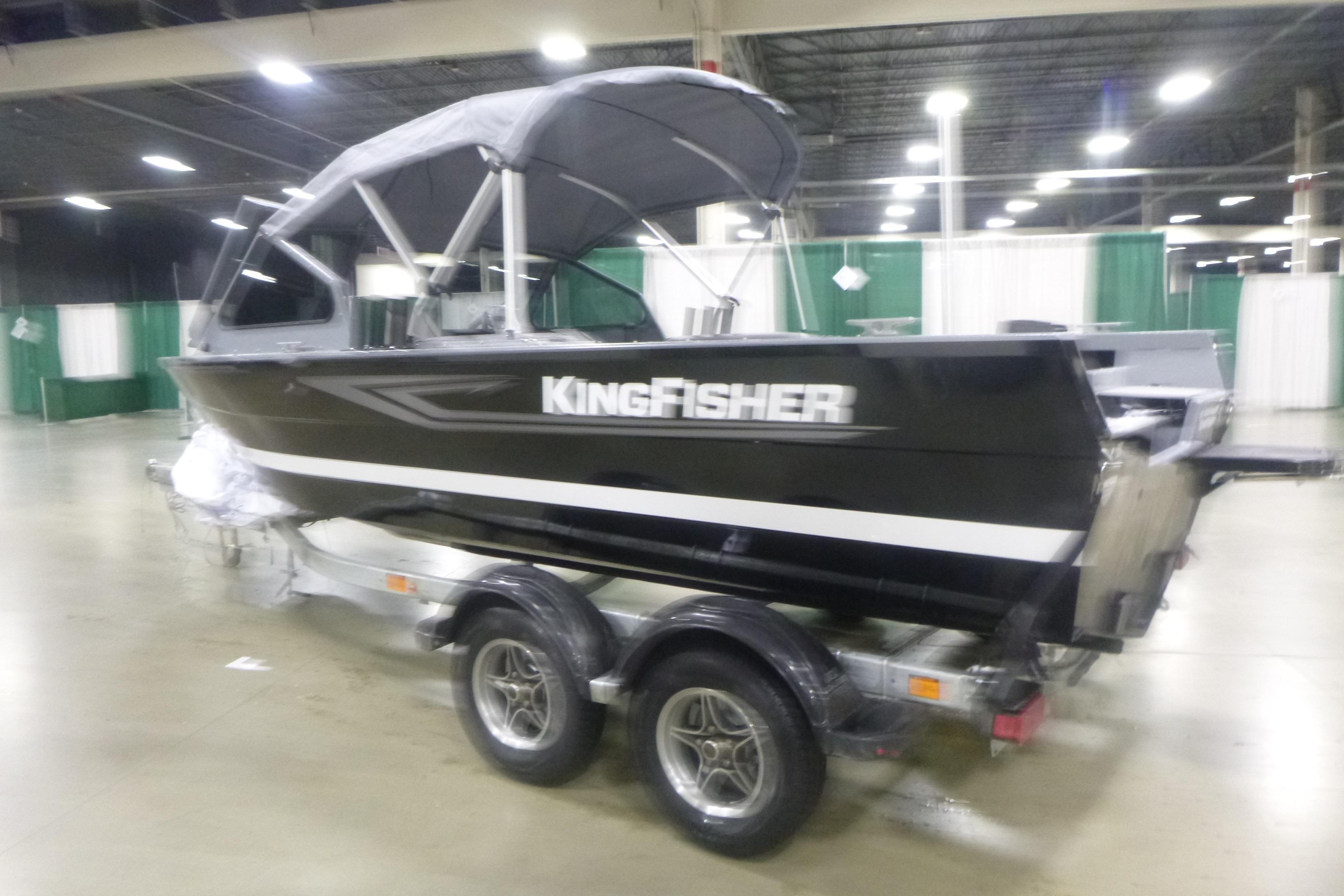 2026 KingFisher 2025 Falcon boat on trailer in indoor showroom.