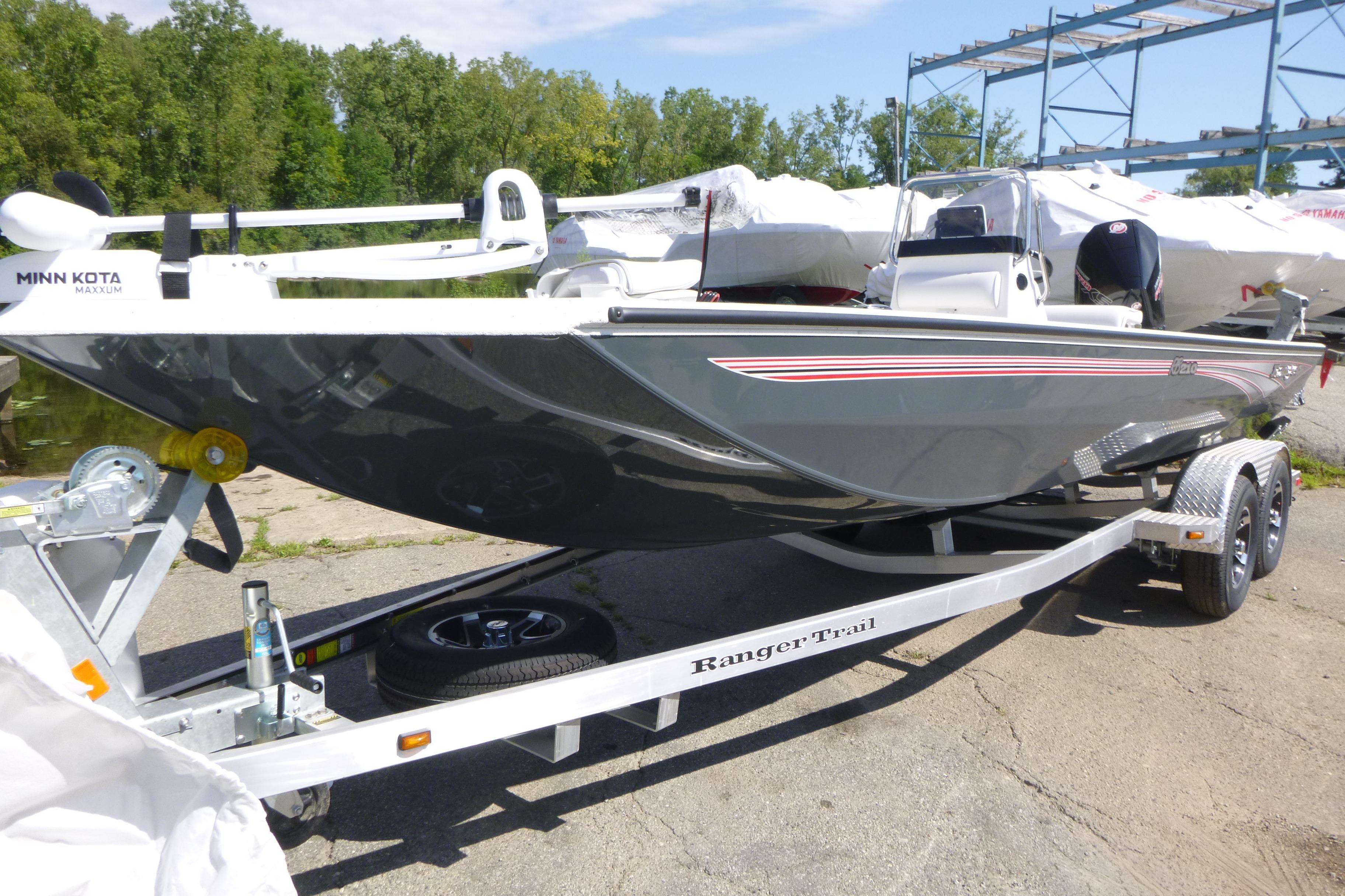 2025 Ranger RB210 boat on trailer, featuring Minn Kota Maxxum motor, parked outdoors.
