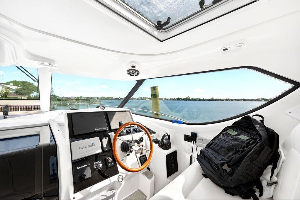 Interior view of 2006 Tiara Yachts 4300 Sovran helm with Garmin navigation system.