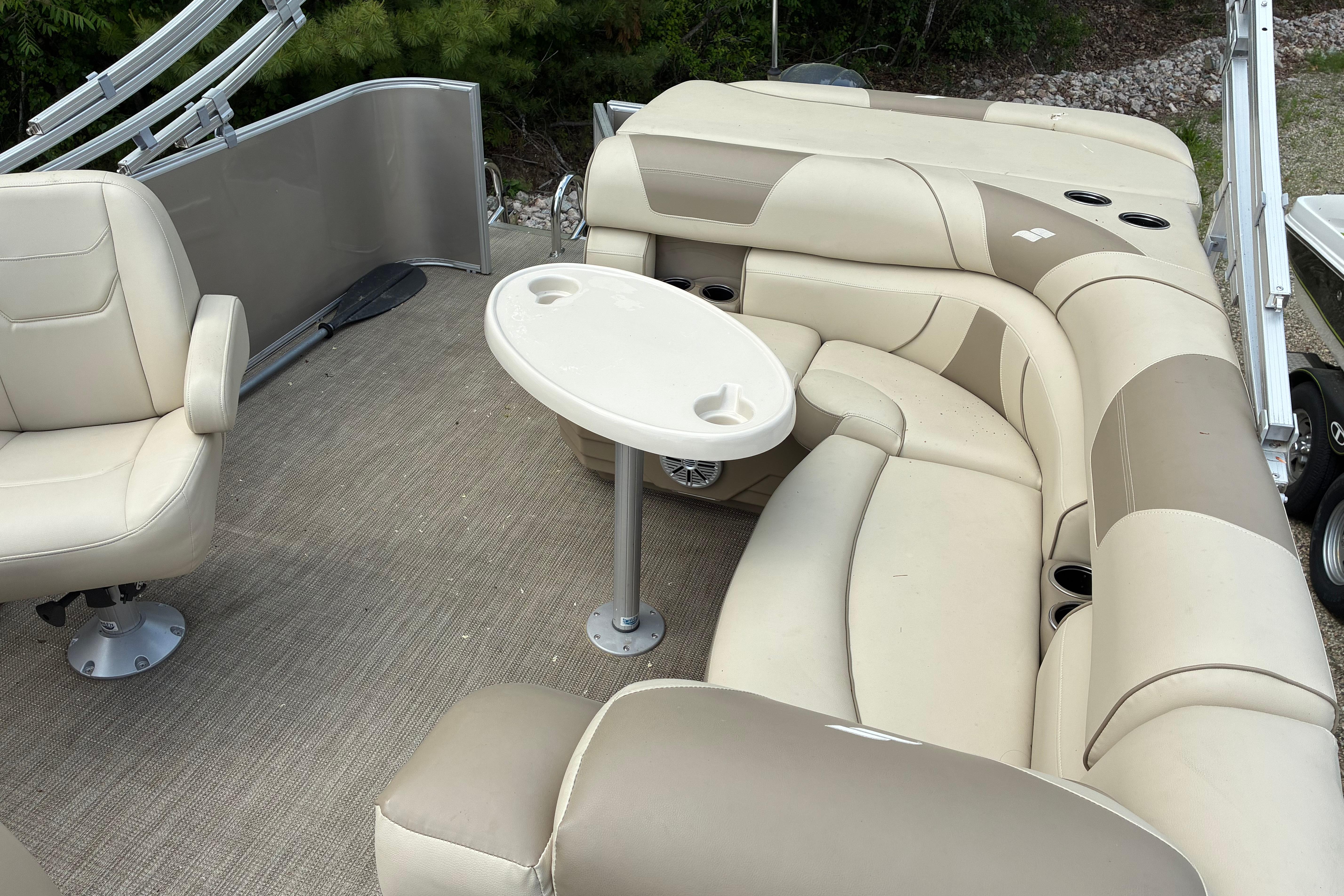 Luxurious seating area on a 2020 Starcraft EX 20 C pontoon boat with beige upholstery.