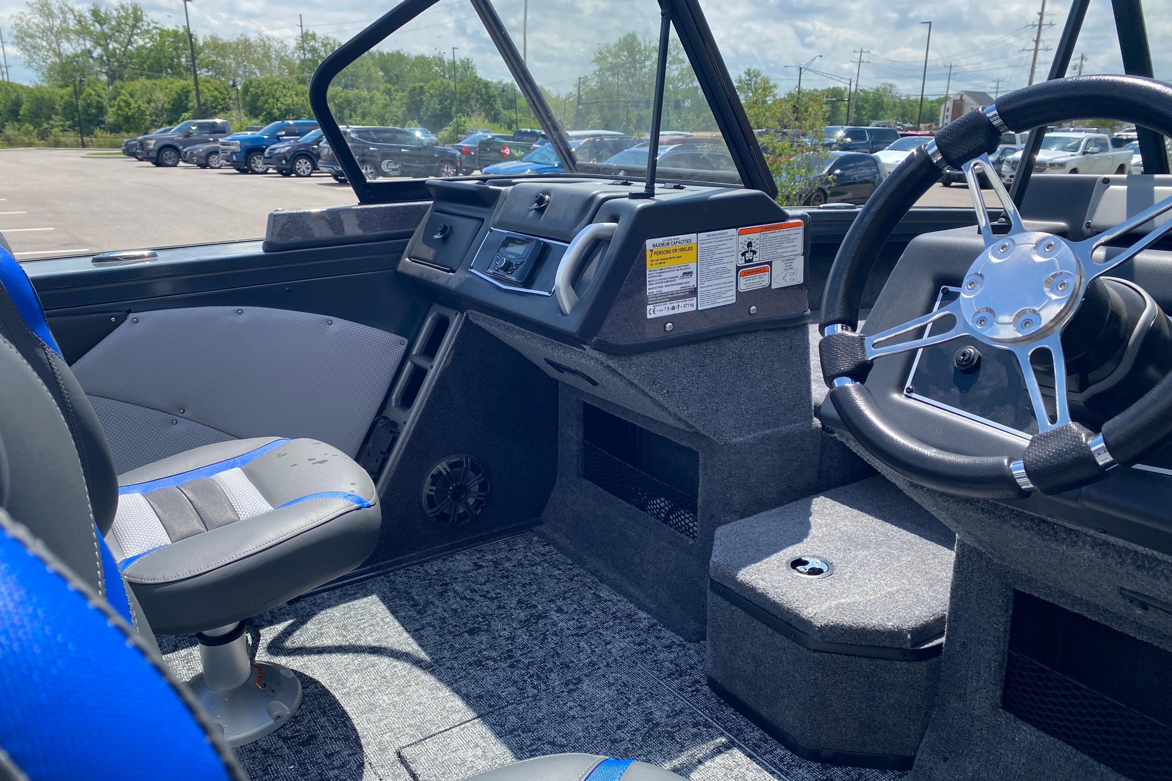 Interior of 2026 Ranger VX1888 WT boat with steering wheel and seating.