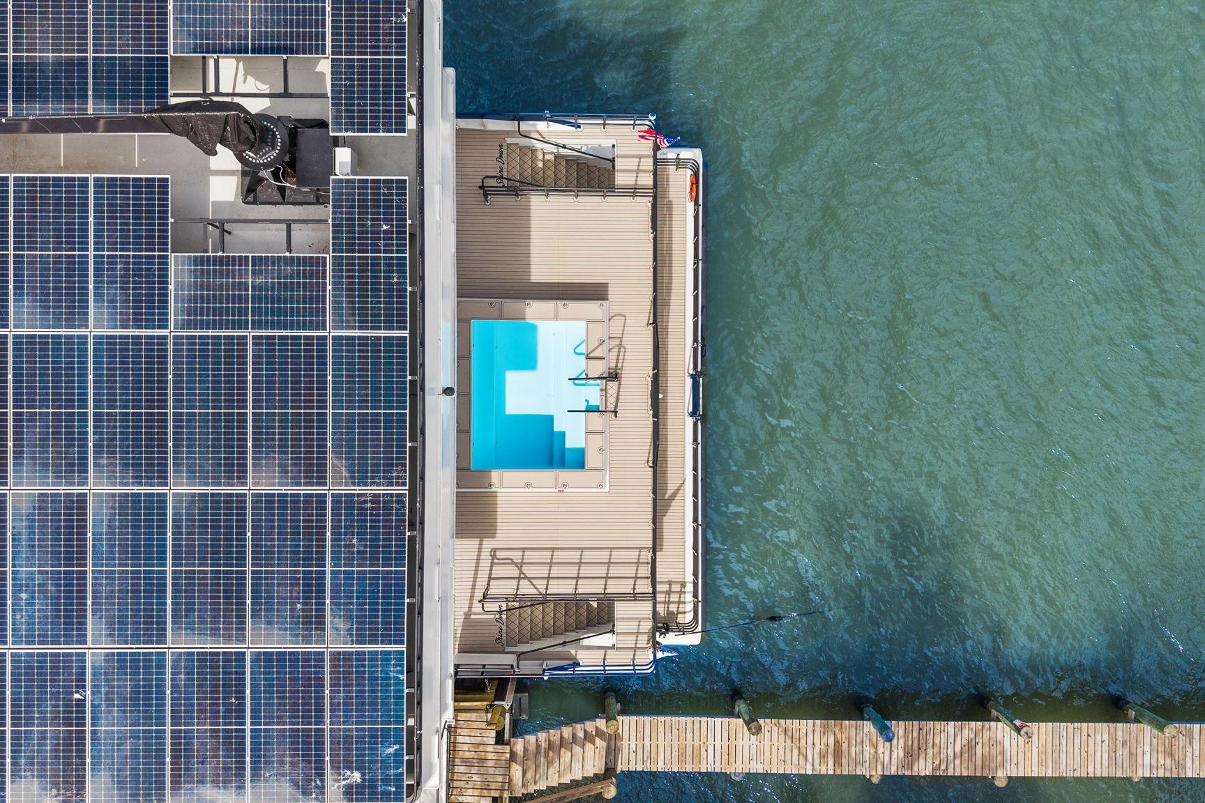 Aerial view of Breaux Brothers 120 GLV yacht with solar panels and pool, 2025 model.