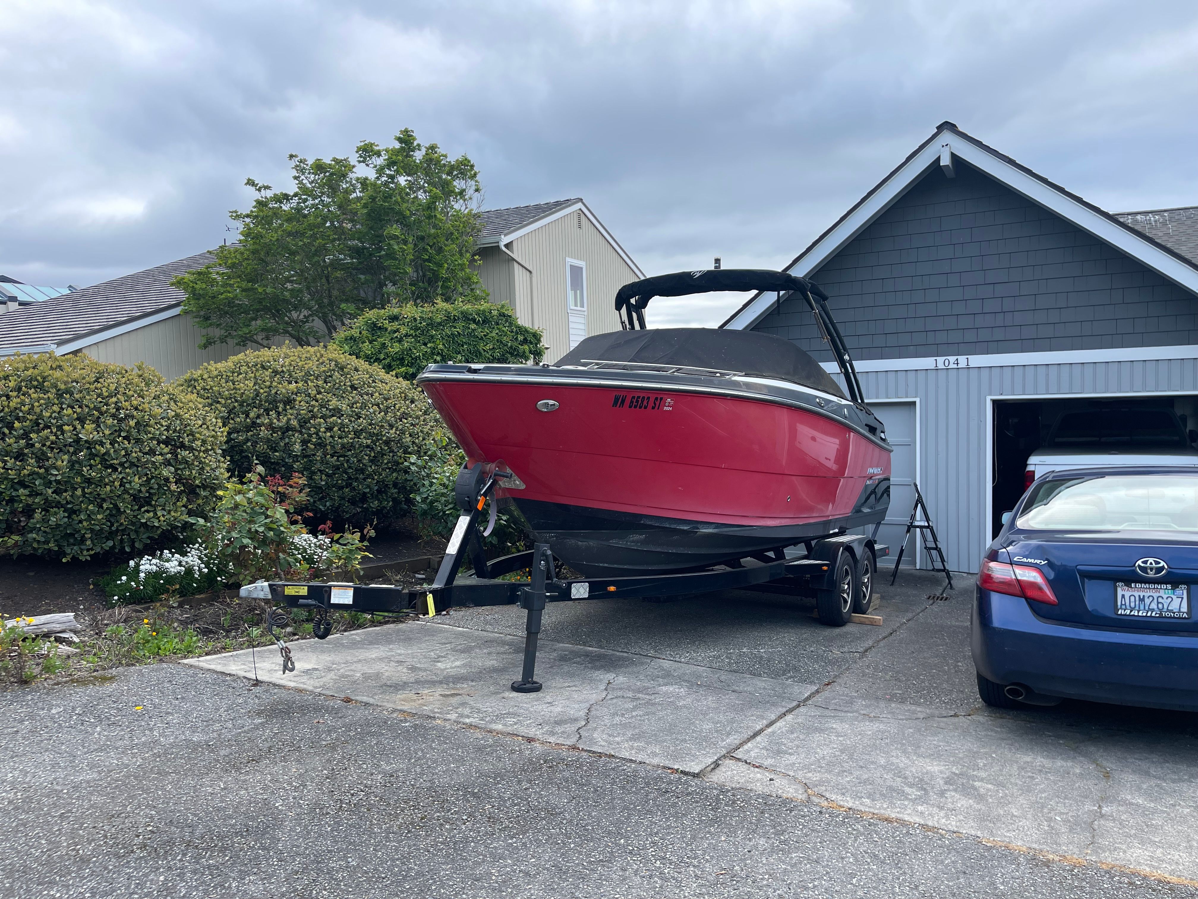 2019 Monterey 258SS Super Sport boat on trailer in driveway.