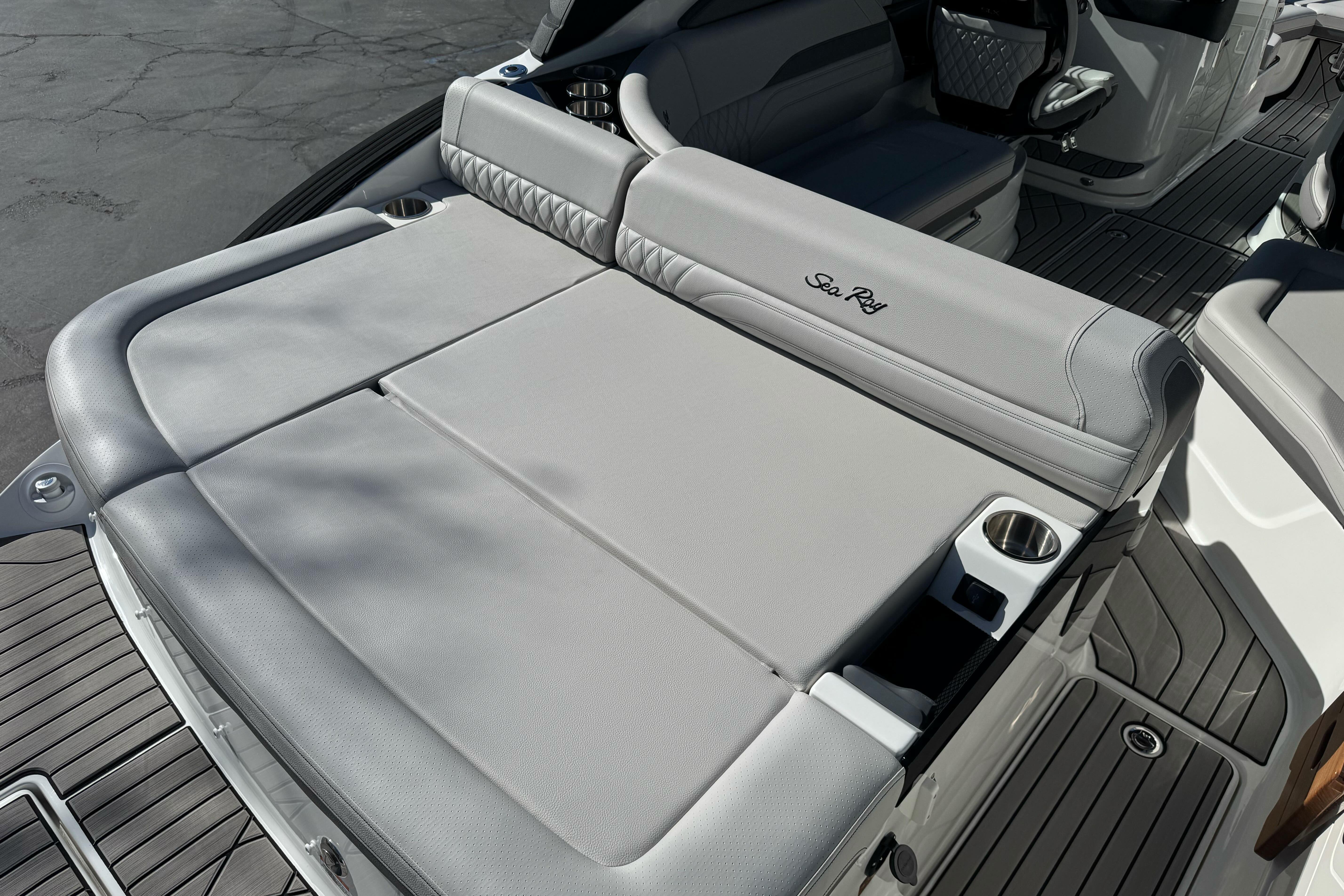 2026 Sea Ray SLX 260 boat with luxurious gray seating and cup holders.