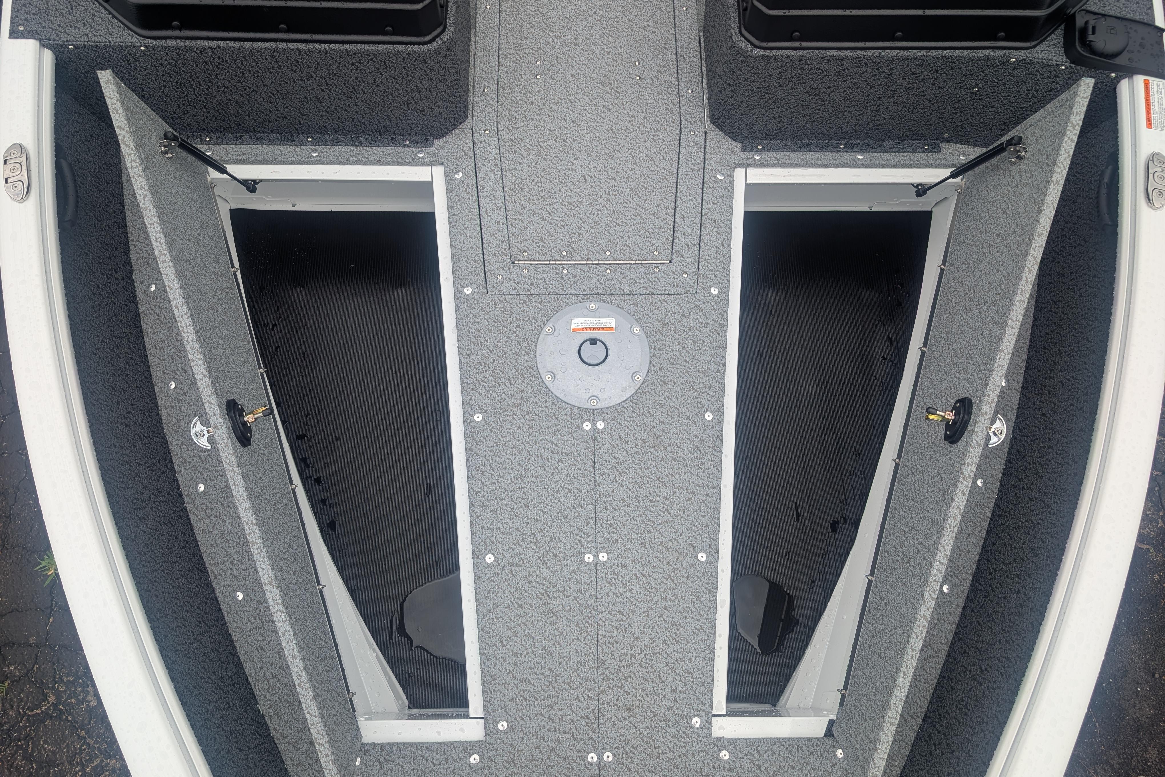 2026 Lund 1800 Explorer Sport boat interior with open storage compartments.