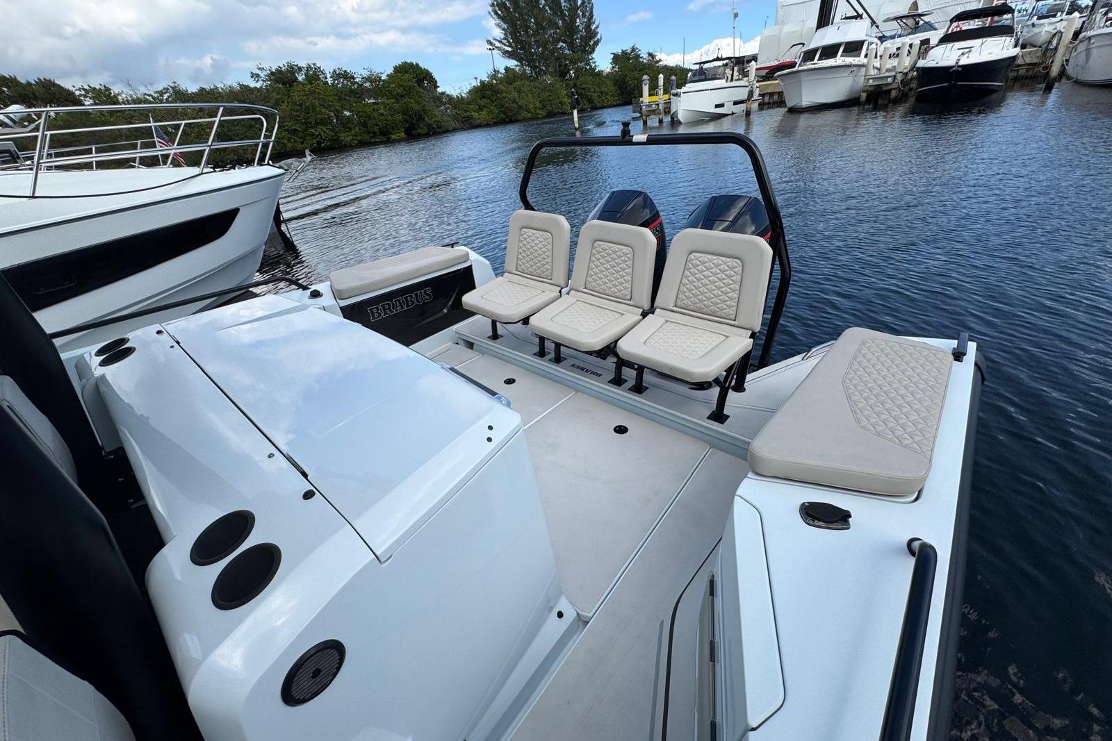 2023 BRABUS Shadow 900 ST luxury boat interior with seating and water view.