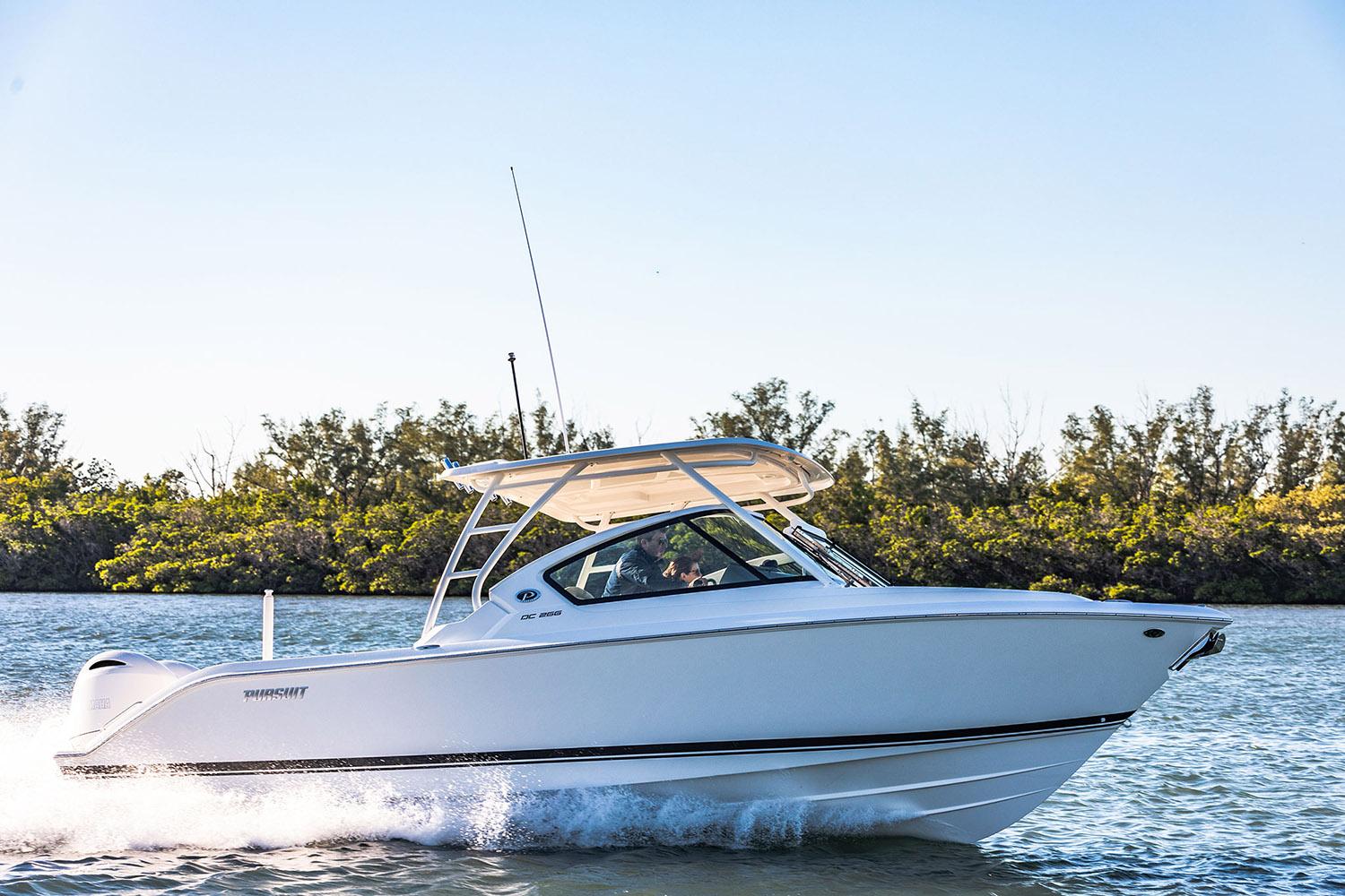 Manufacturer Provided Image: 2025 Pursuit DC 266 Dual Console boat cruising on a sunny day.