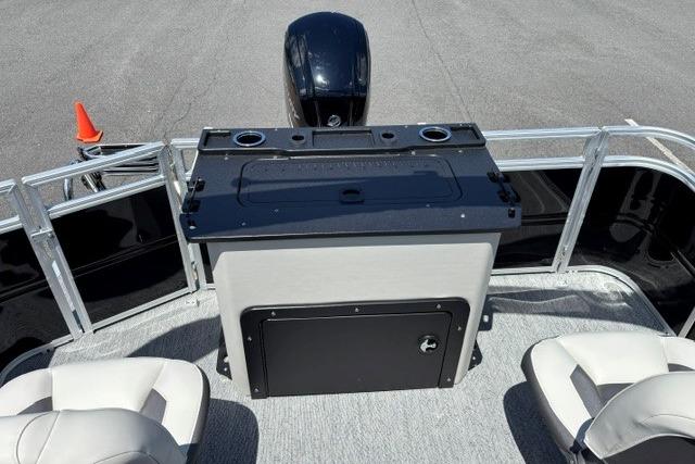2026 Sun Tracker Fishin' Barge 20 DLX interior with seating and storage console.