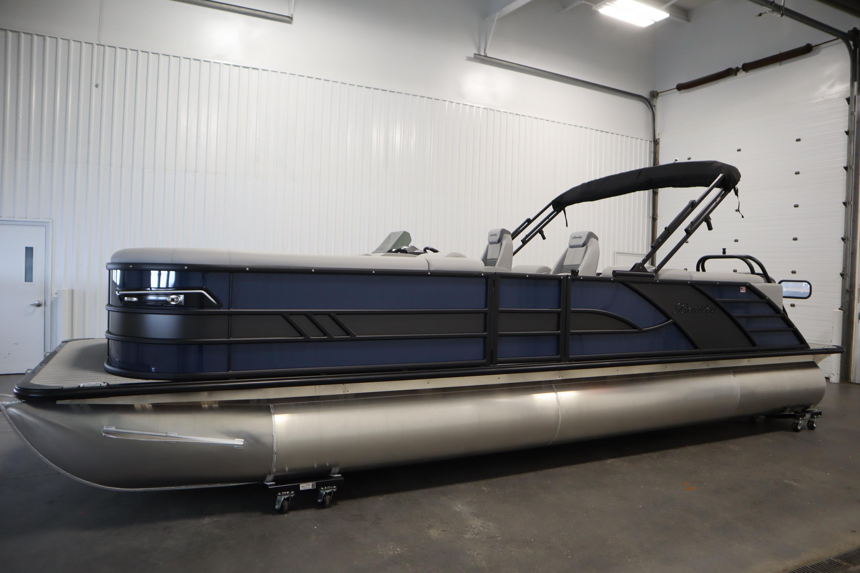 2025 Bentley Pontoons Elite 253 Admiral Tri-toon in a showroom setting.