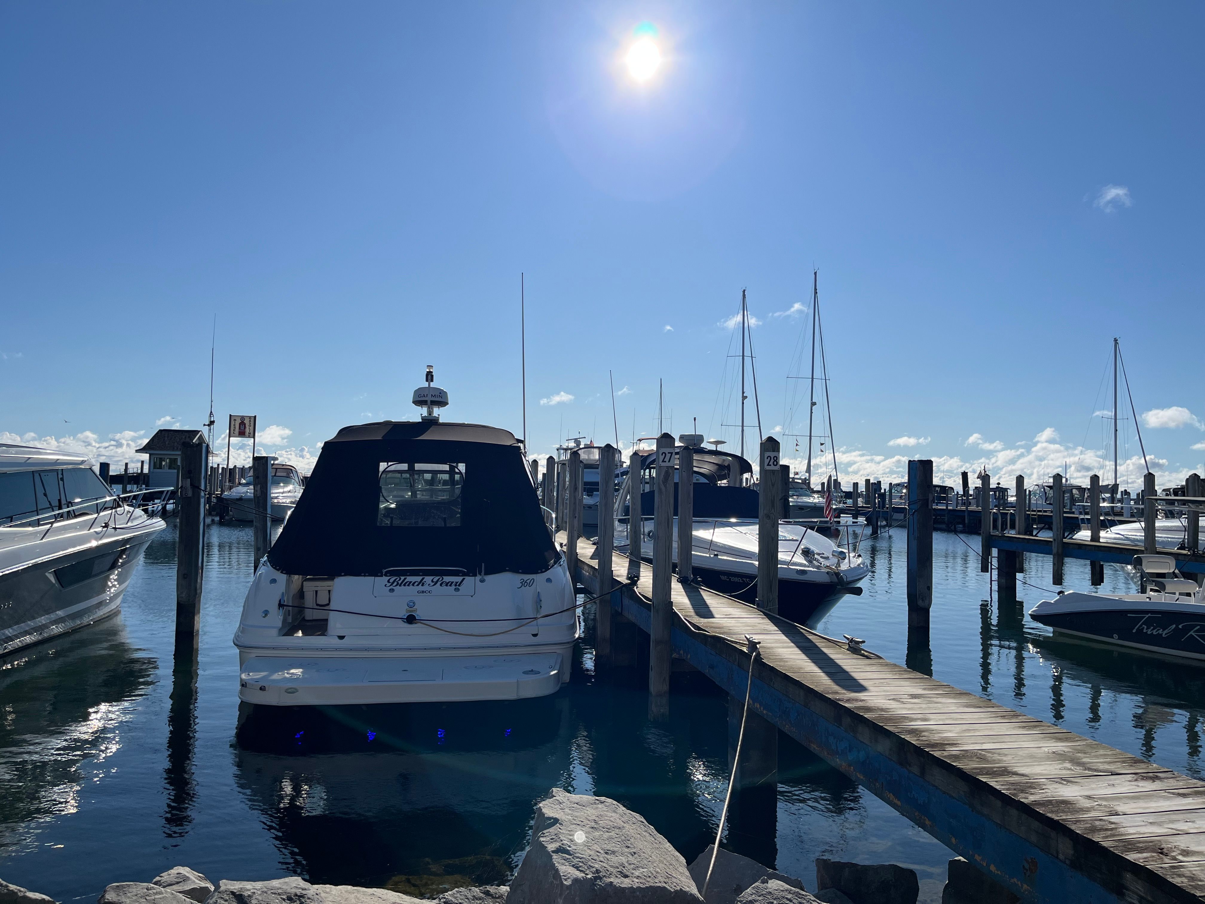 2005 Sea Ray Sundancer docked in sunny marina.