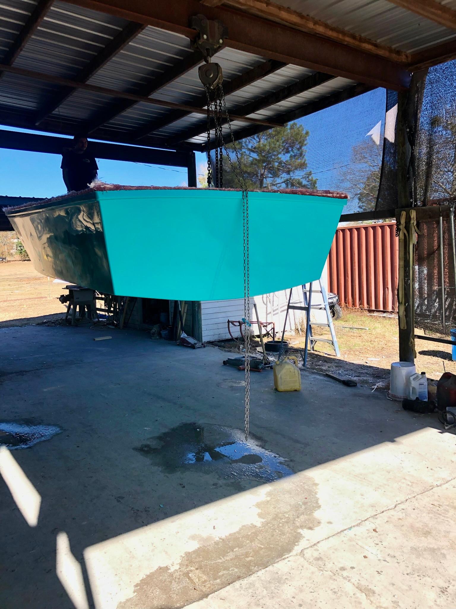 2024 Rambo 22 Center Console boat in a covered outdoor workshop.