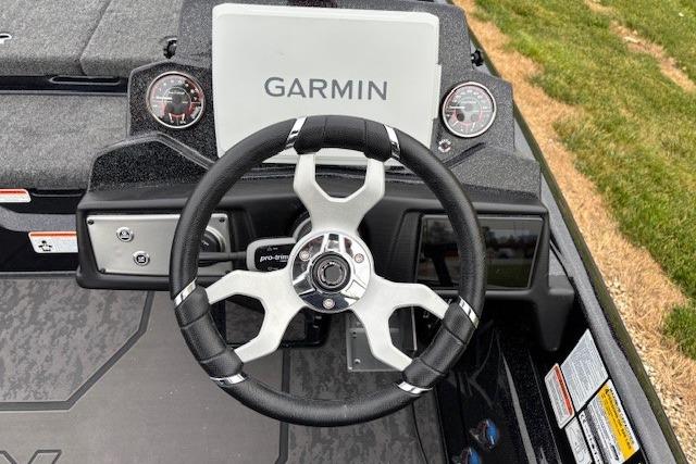 Steering wheel of 2026 Nitro Z21 XL Pro boat with Garmin display and gauges.