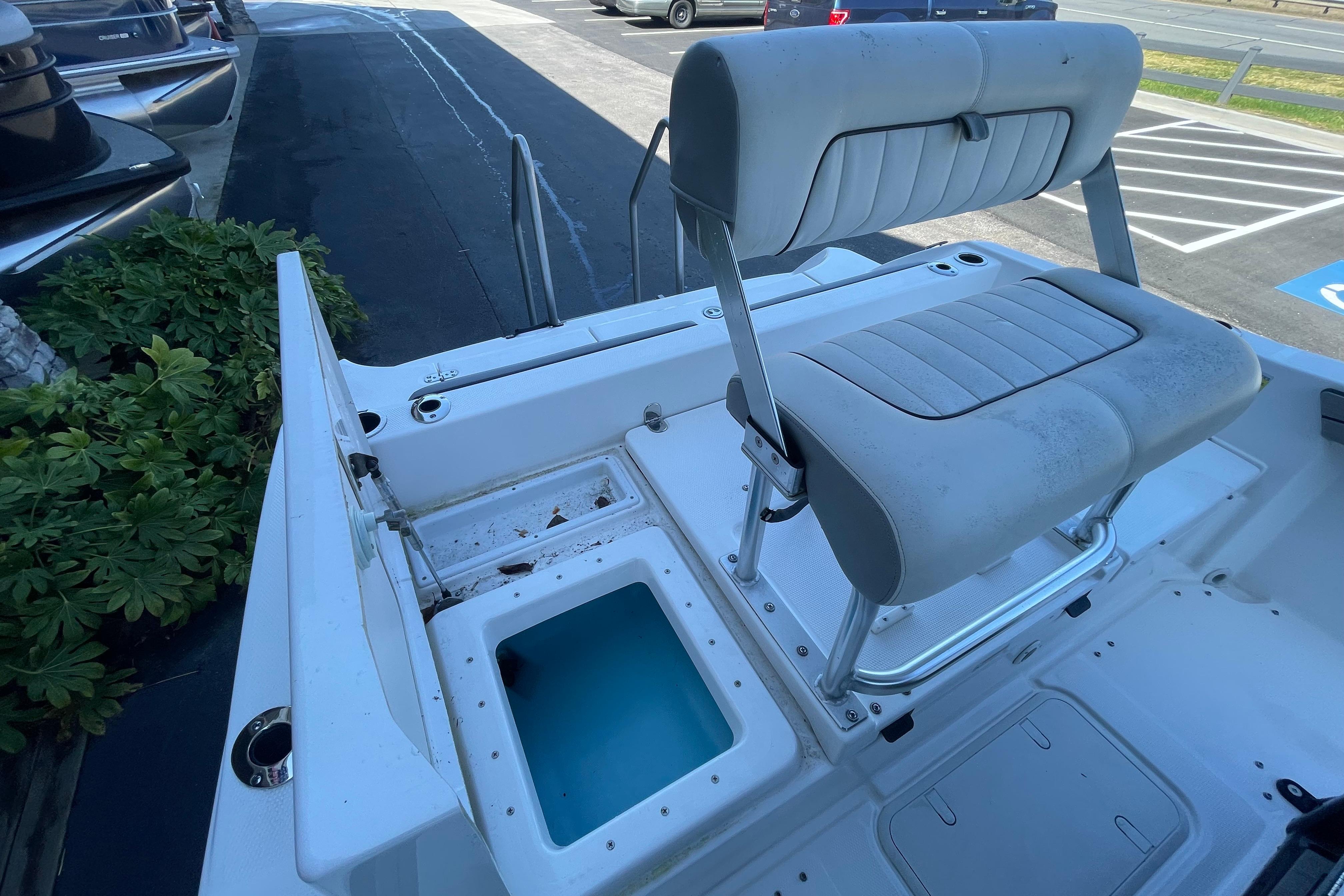 2021 Yamaha Boats 195 FSH Sport interior with seating and storage compartments.