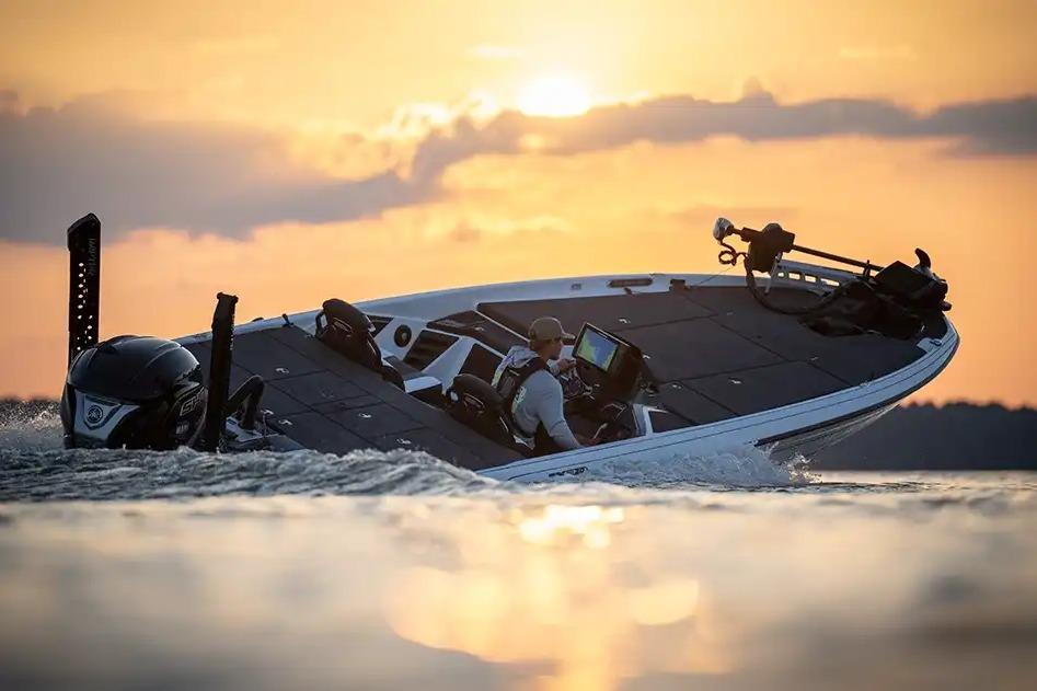 Manufacturer Provided Image: 2026 Skeeter FXR20 FLEX boat cruising at sunset on a serene lake.