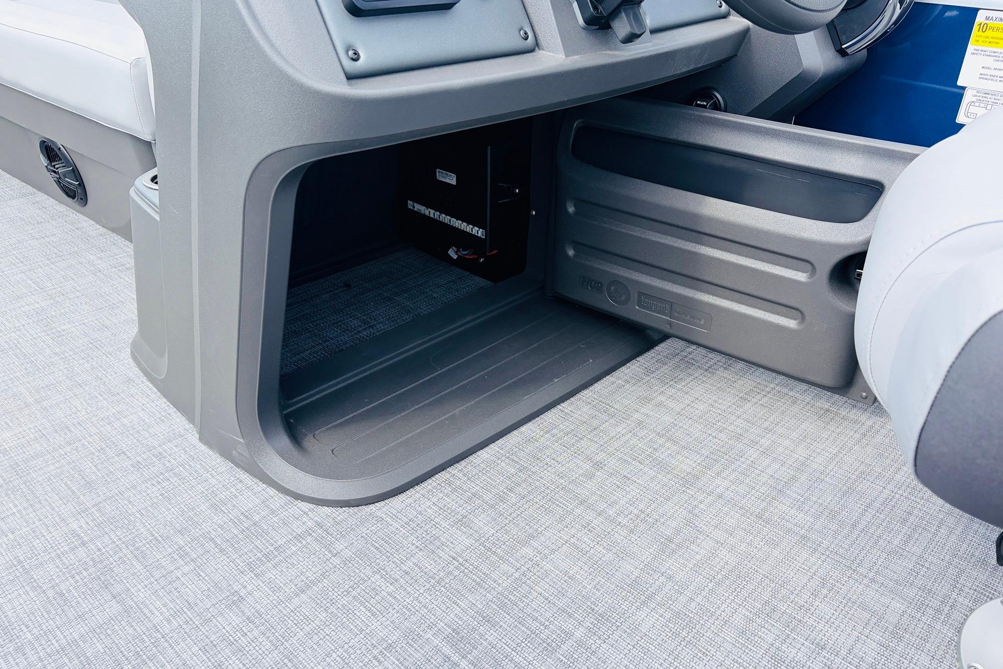 Interior view of 2026 Sun Tracker SportFish 22 DLX boat's storage compartment.
