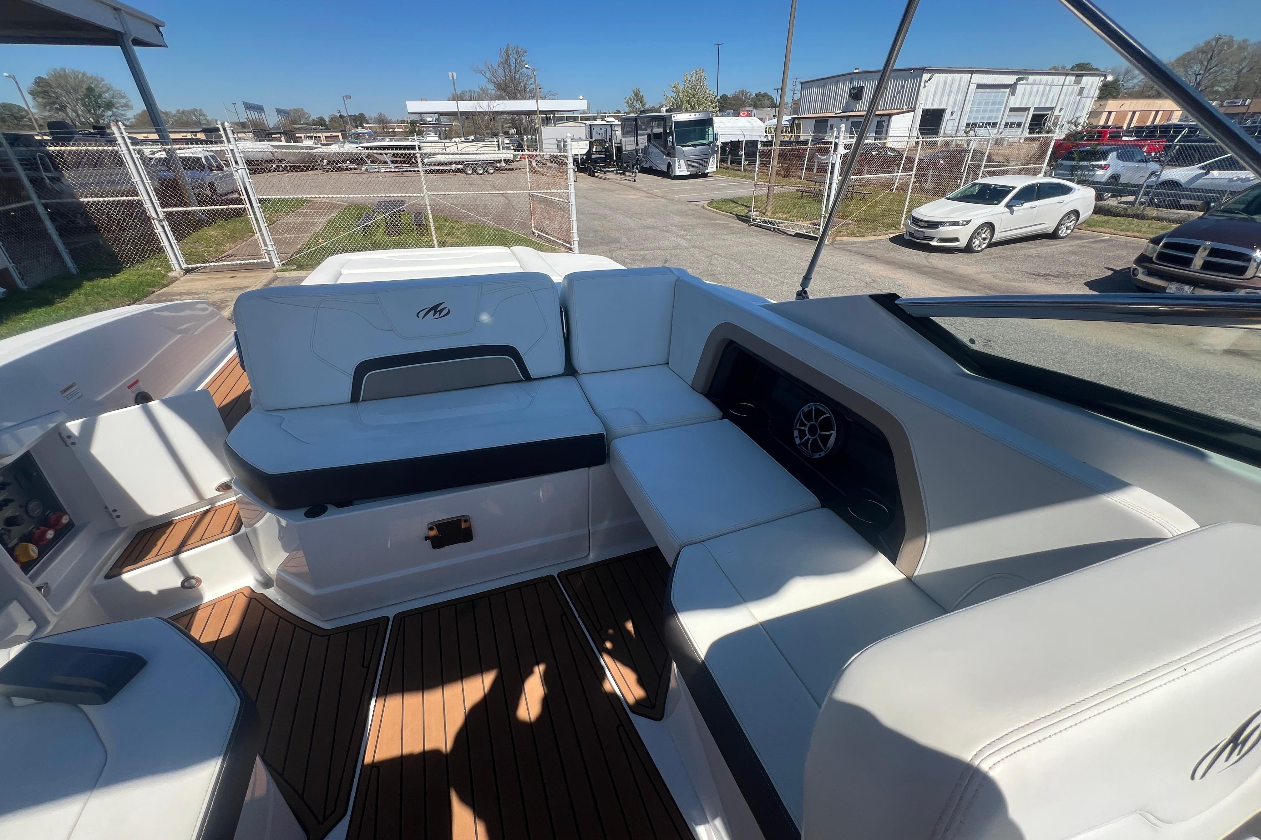 2017 Monterey 298SS Super Sport boat interior with white seating and wood flooring.