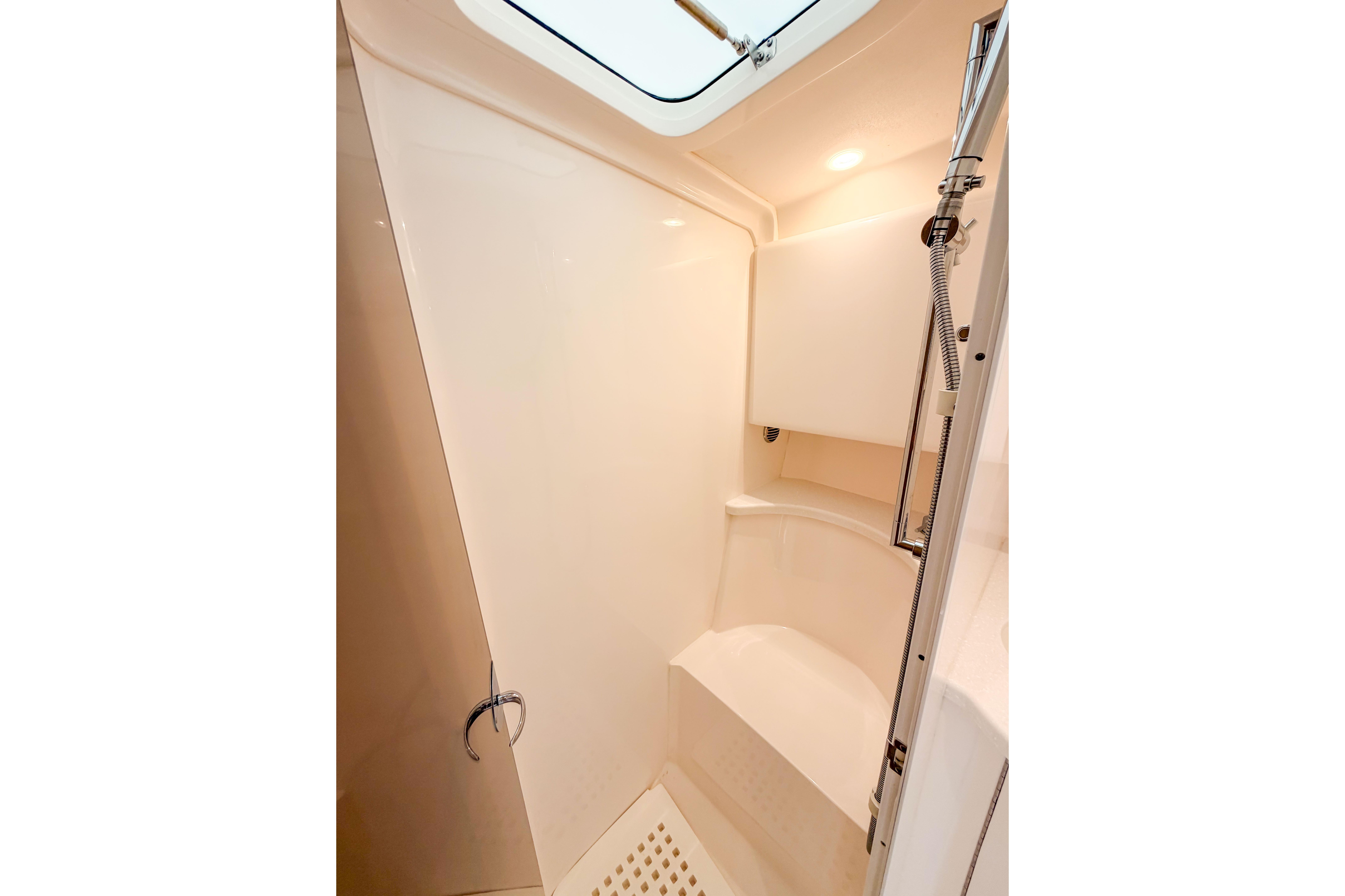 Shower area in 2021 Intrepid 409 Valor boat, featuring sleek design and modern fixtures.