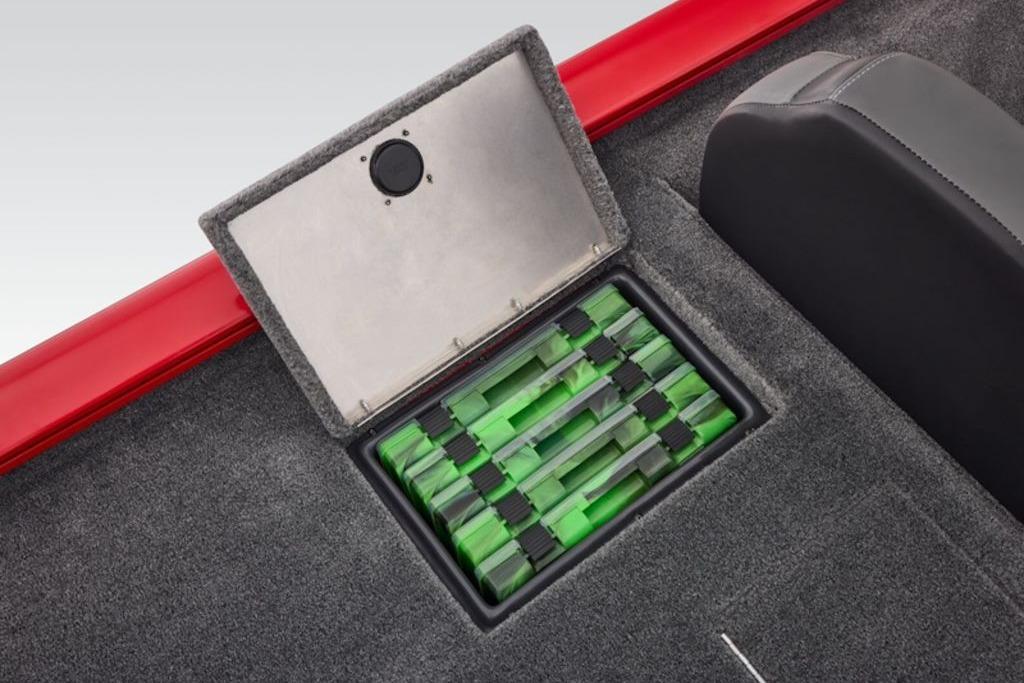 Storage compartment in 2026 Tracker Pro Team 190 boat with organized green tackle boxes.