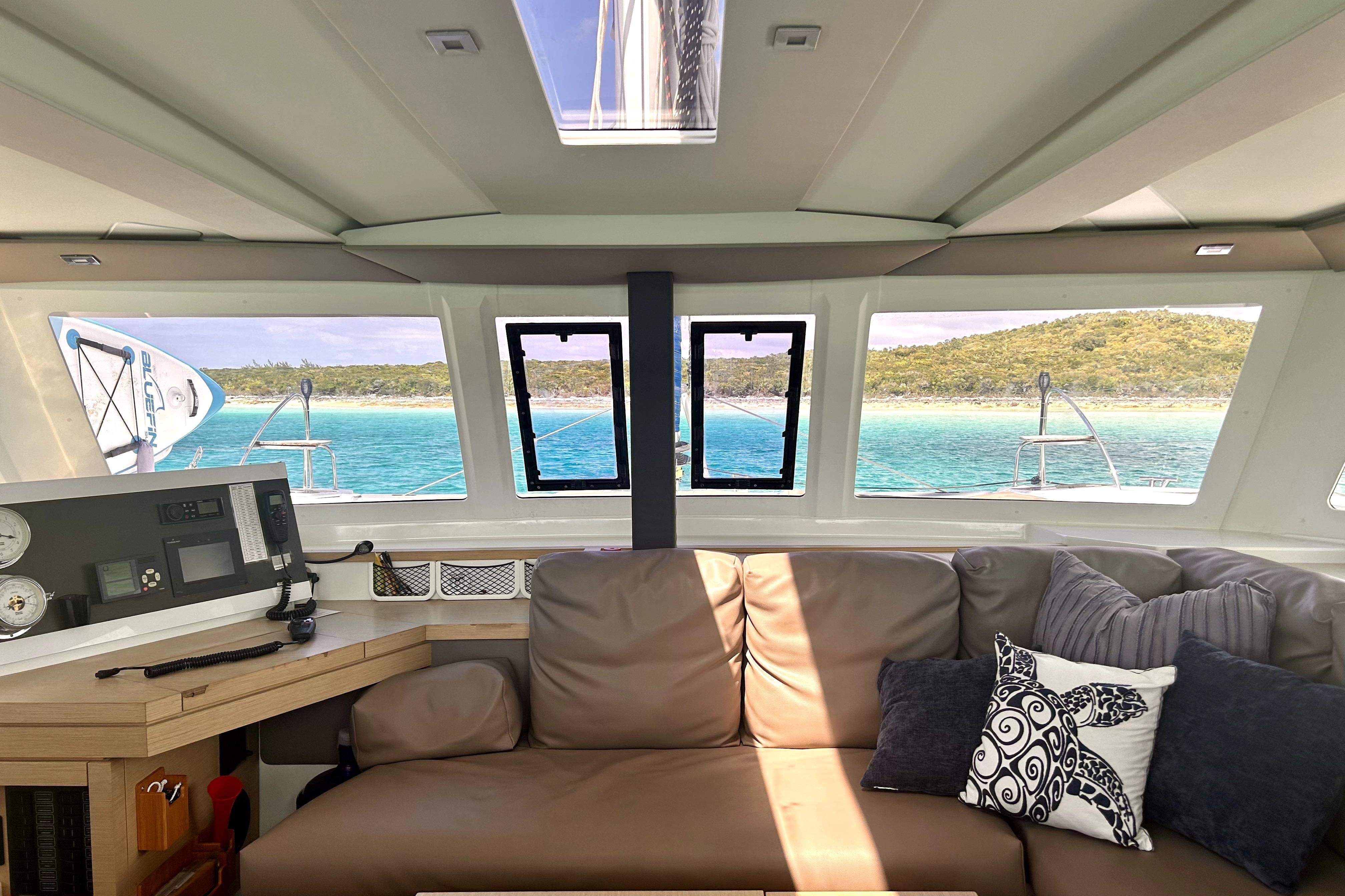 Interior view of 2018 Fountaine Pajot Lucia 40 catamaran with ocean and island scenery.