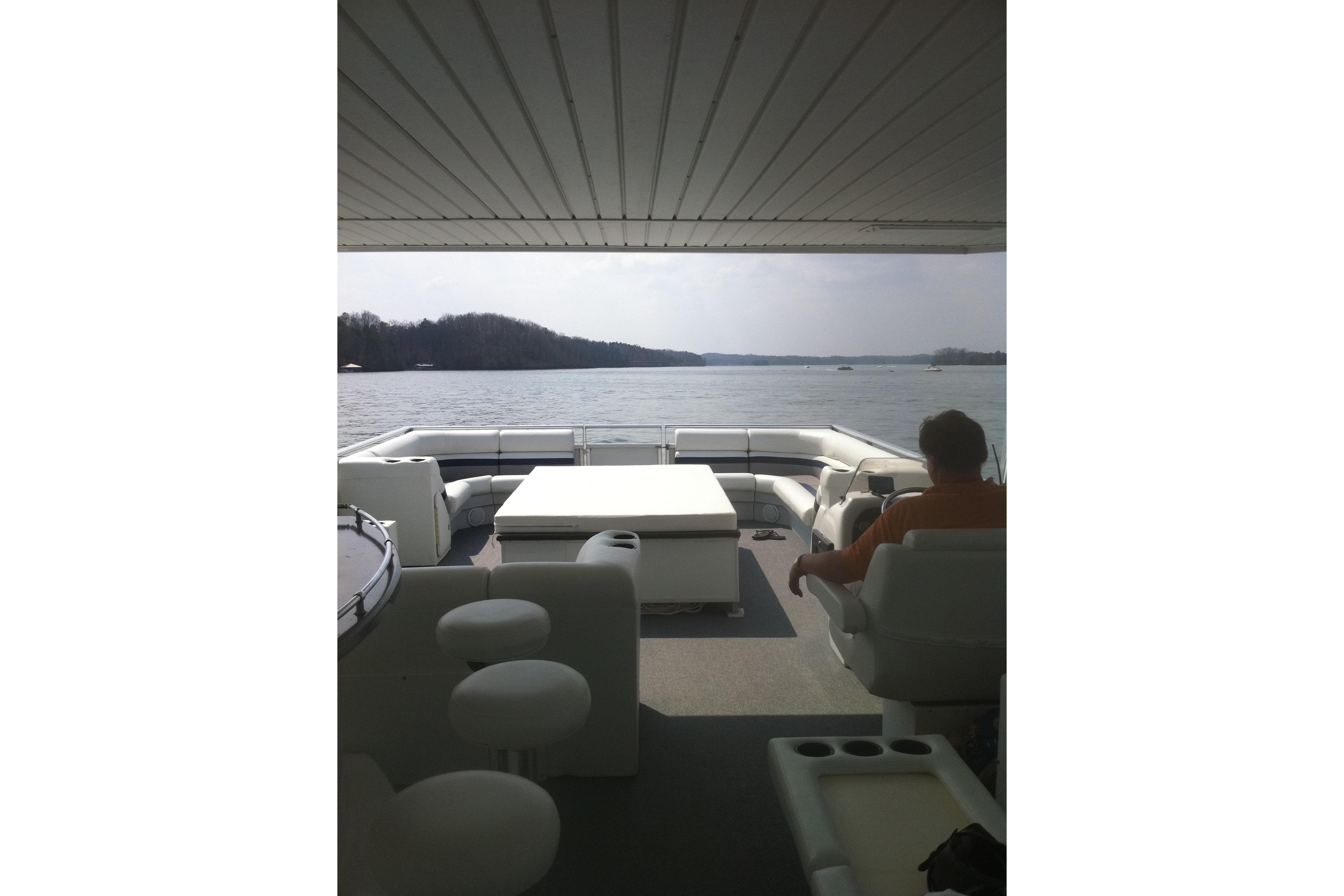 2008 Destination Yachts 45X14 houseboat interior with lake view and seating area.