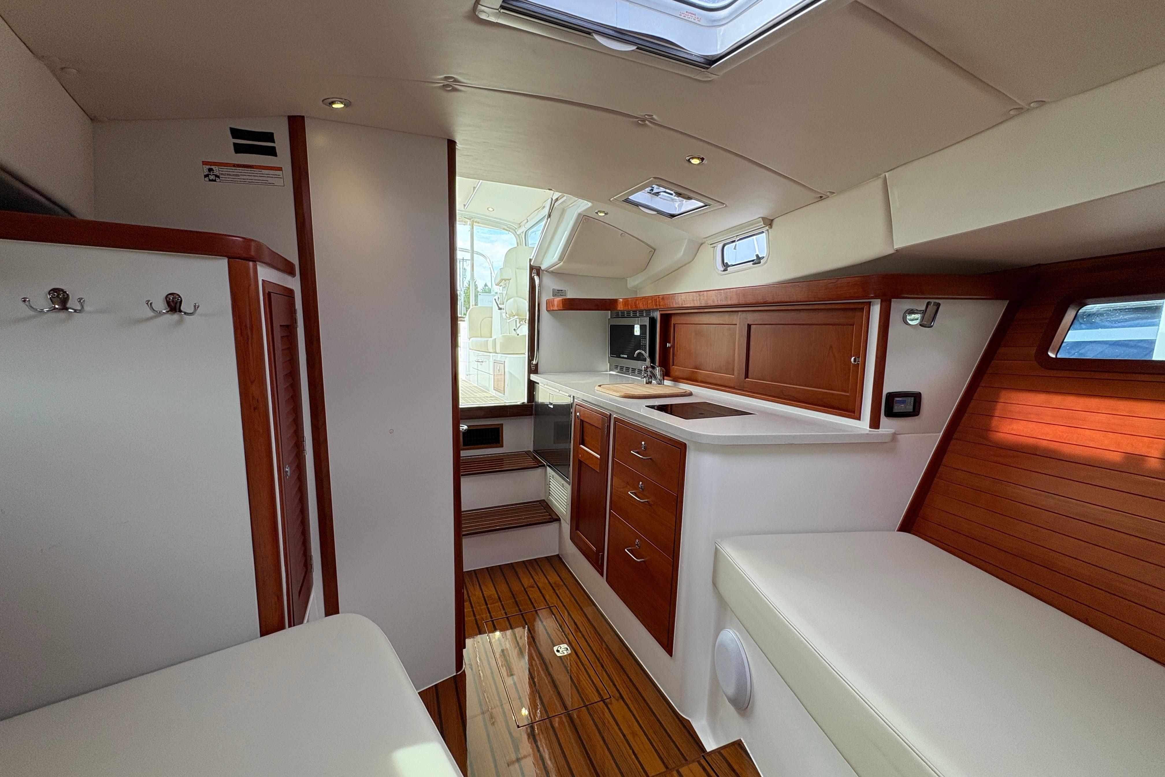 Luxurious interior of 2023 MJM 35 yacht with elegant wood finishes and modern amenities.