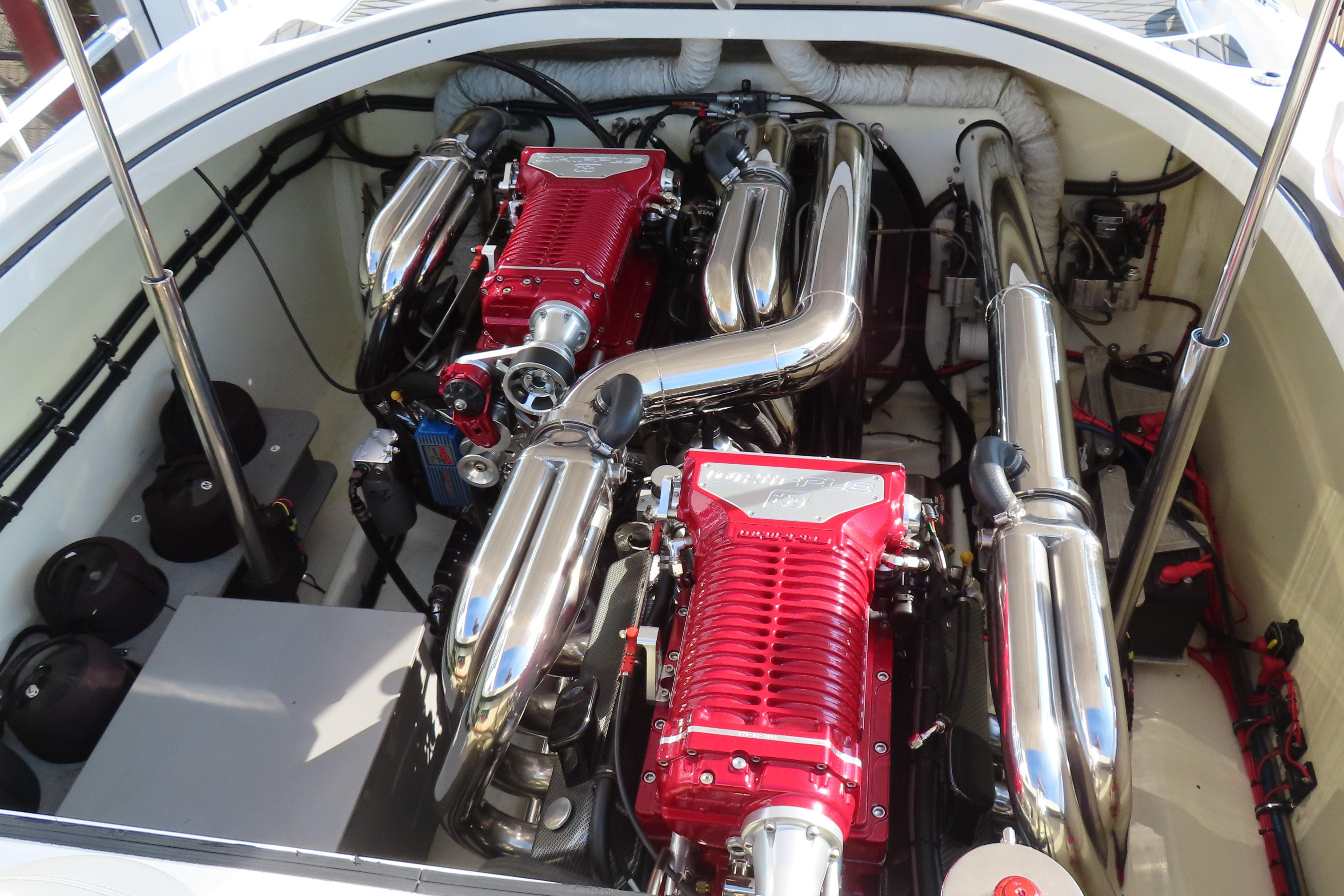 Engine compartment of a 2013 Nordic 39 POKER RUN boat with dual red engines.